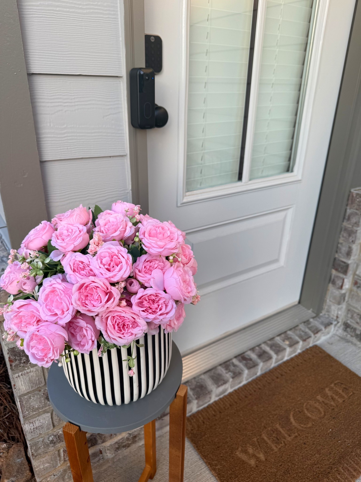 Spring!!! at the front door 🌸

Amazon flowers + Blink doorbell
Target welcome mat
Walmart plant stand - I thought it was white so maybe paint her white or black! 

Little spring touches around the house just make everything feel happier 💗 + FLOWERS!!!!! 

#springdecor #springfrontporch #springhome #amazonhomefinds #amazonhome #targethome #walmartfinds #ltkhome #frontdoorinspo #entrywaydecor #neutralhome #homedecorfinds

#LTKHome #LTKSpringSale #LTKSeasonal