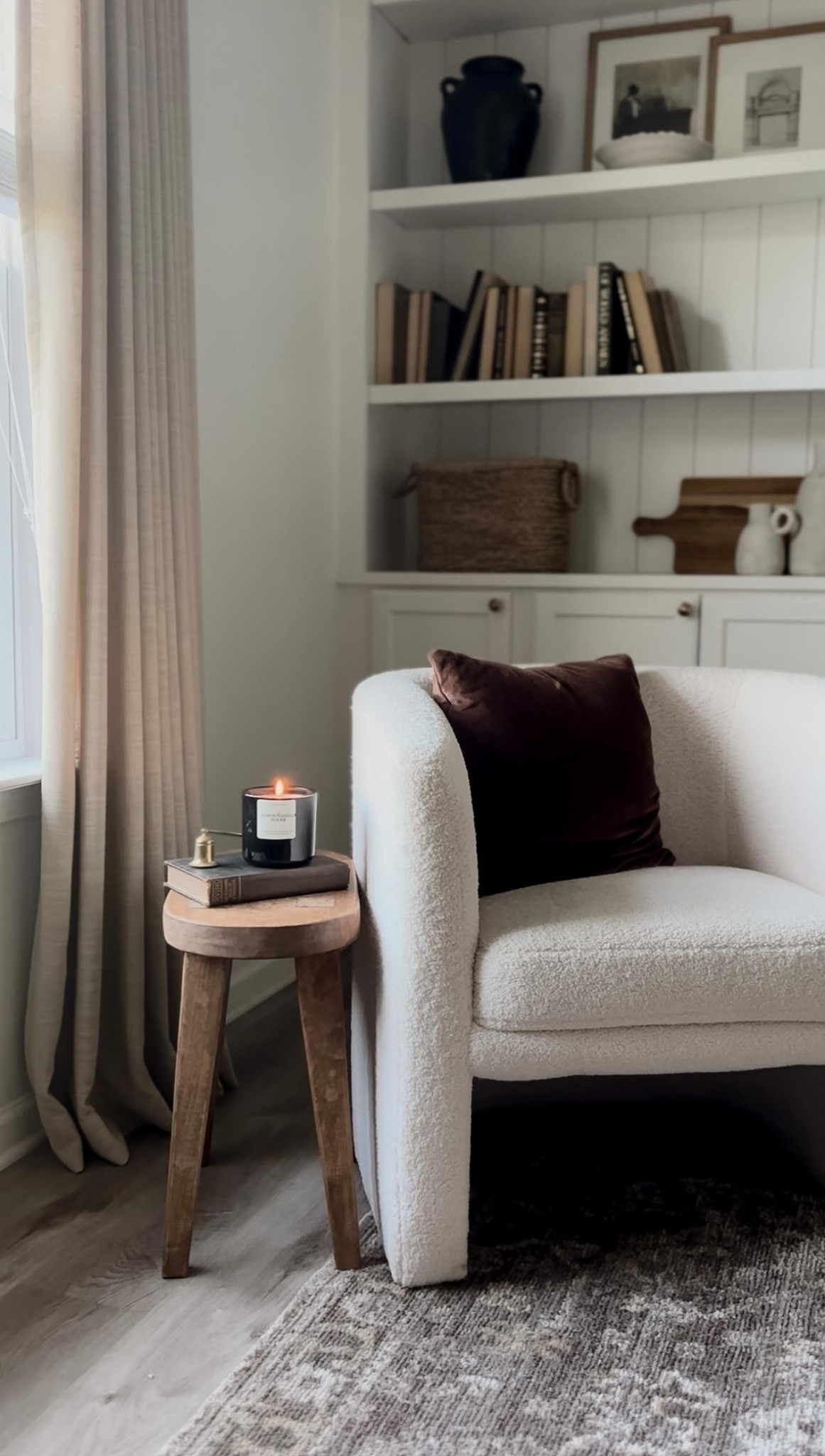 Neutral living room, white living room, white accent chair, bouccle accent chair, brown throw pillow, wooden end table, gold candle snuffer, shelf decor, living room shelving ideas, shelf styling tips, shelf inspo, corner decor, affordable living room finds, living room ideas 

#LTKSaleAlert #LTKFindsUnder50 #LTKHome