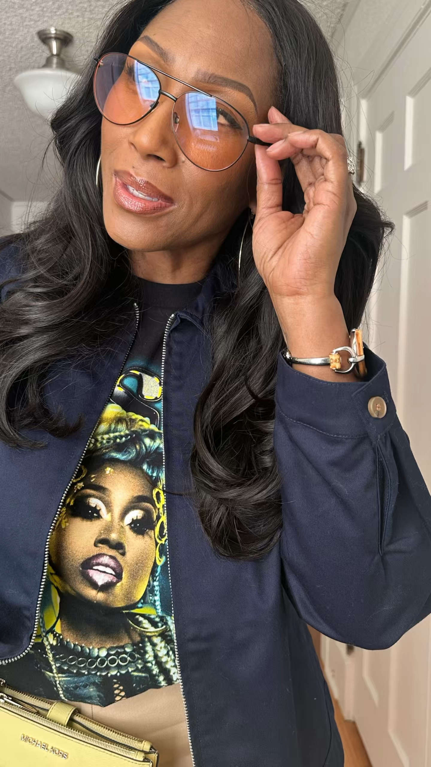 Since I’m on a concert kick, let’s bring in Missy! We had a blast at her concert last Summer. I paired this Tee with a wide leg pant, a simple jacket, sunglasses, and gold hoop earrings. I opted for a yellow wristlet that complements the t-shirt  

#LTKStyleTip