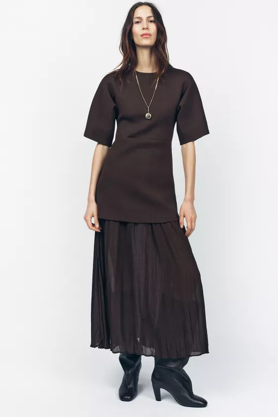 Dress with round neck and short sleeves. Pleated fabric detail at hem. Back hidden in-seam zip cl... | Zara US