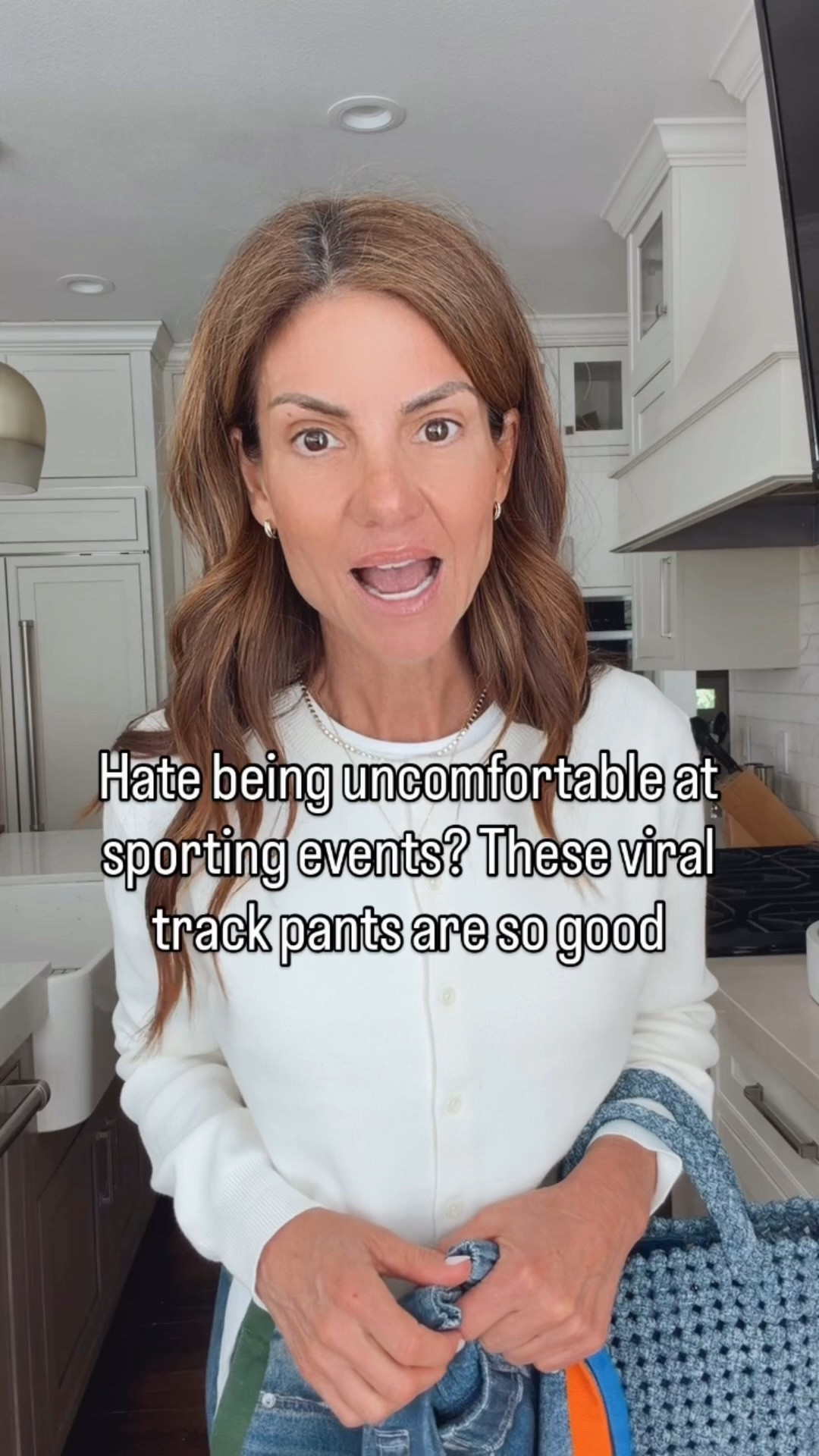 Sport mom outfit idea 🤍 These viral track pants feel like sweatpants but still look put together. The expandable waistband makes them so comfortable for long sporting events, and I love all the color options with the stripe detail to match your kids’ team colors.

Paired them with a white tee that isn’t see-through, a soft cardigan, easy loafers, and a denim bag for an effortless outfit of the day. Plus I have a 20% off code for the pants. 
￼ I am 5'7" tall and wearing a size extra small in the pants, they run large, I would size down. I am wearing a size small on top.  
discount code for 20% off the pants: RB20.

#LTKootd #LTKOver40 #LTKSaleAlert