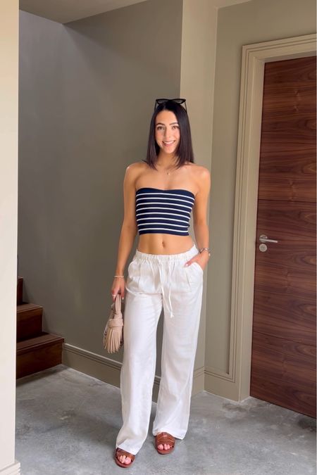Linen trousers, striped tube top, Ego bag, brown sandals, stripes, neutral outfit, monochrome style, summer outfit, transitional styling, casual day outfit 

#LTKSeasonal #LTKeurope #LTKstyletip