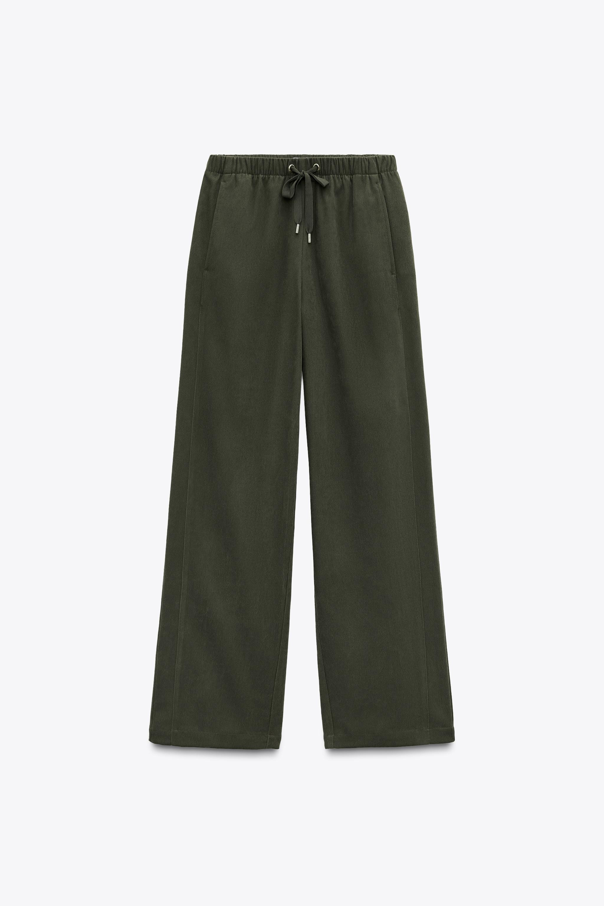 High-waist trousers with an elasticated waistband and adjustable drawstrings. Side pockets and pa... | Zara UK