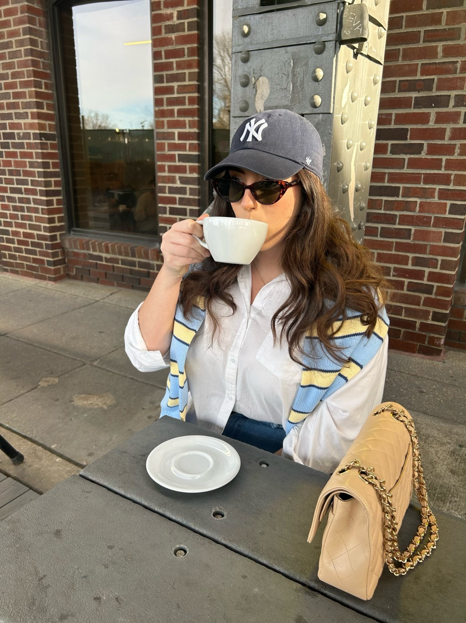 An oversized white button down with a striped sweater over the shoulders makes the perfect spring transitional outfit ￼

#LTKSpringSale