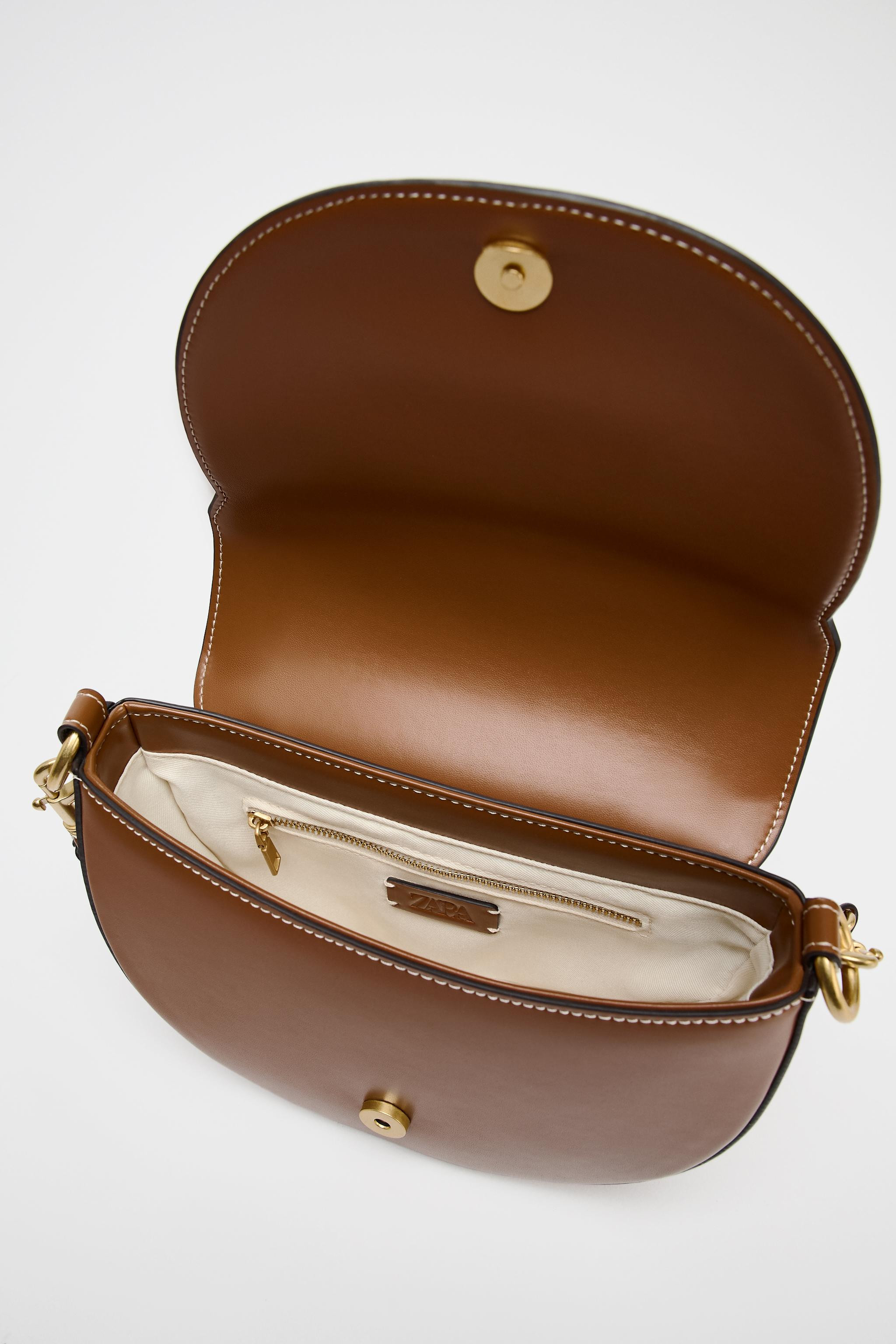 Rigid bag with contrasting topstitching. Removable straps, one canvas shoulder strap, one crossbo... | Zara US