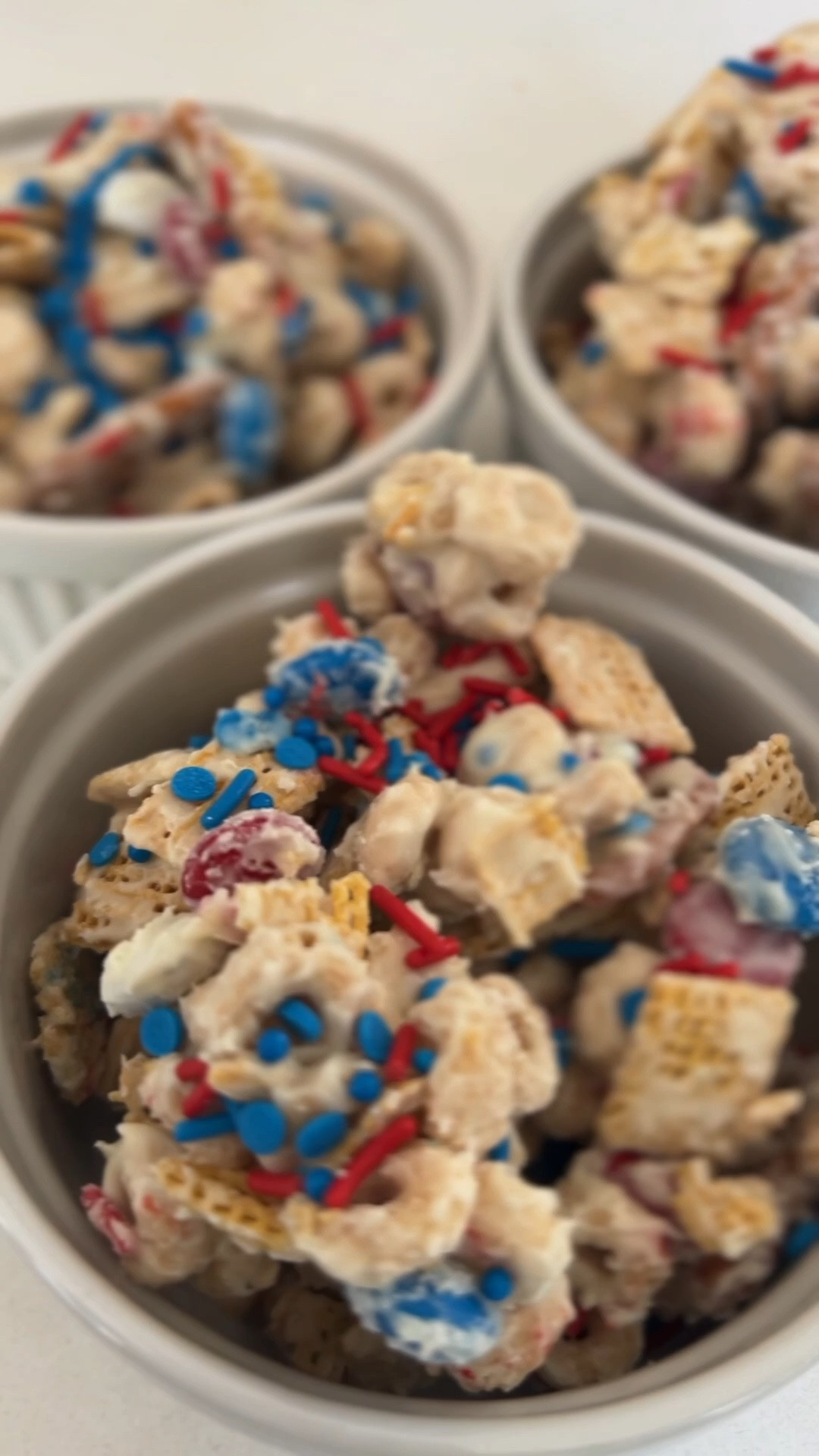 Red, white, and blue trail mix recipe:
 2 1/2 cups Chex cereal corn or rice 1 cup of pretzels 2 cups Honey Nut Cheerios cereal 1 cup red, white, and blue M&M’s 2 3/4 cups white chocolate chips 1 1/2 teaspoons vegetable oil or canola oil festive sprinkles

Line a large sheet pan with parchment paper and set aside. 
In a large bowl combine the Chex, pretzels, Cheerios, and M&M’s. 
In a separate bowl, add the white chocolate chips and vegetable oil. Microwave for 30 seconds, stir, and microwave for another 25 seconds. Stir until melted and smooth. Make sure not to burn chocolate or over melt it.

Pour the melted white chocolate over the snack mix. Work quick to gently stir until cereal mix is well coated in the white chocolate.

Transfer to the prepared sheet pan and spread into an even layer and let it sit for 10-15 minutes to harden. 

Serve and enjoy!

#LTKFamily, memorial weekend, party, summer, kids, party ideas

#LTKmomlife #LTKfoodie #LTKHome
