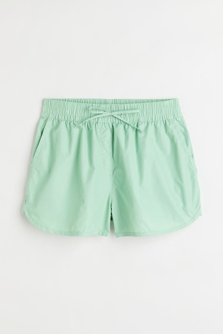 Conscious choice  New ArrivalShorts in woven fabric with a regular waist. Drawstring and covered ... | H&M (US + CA)