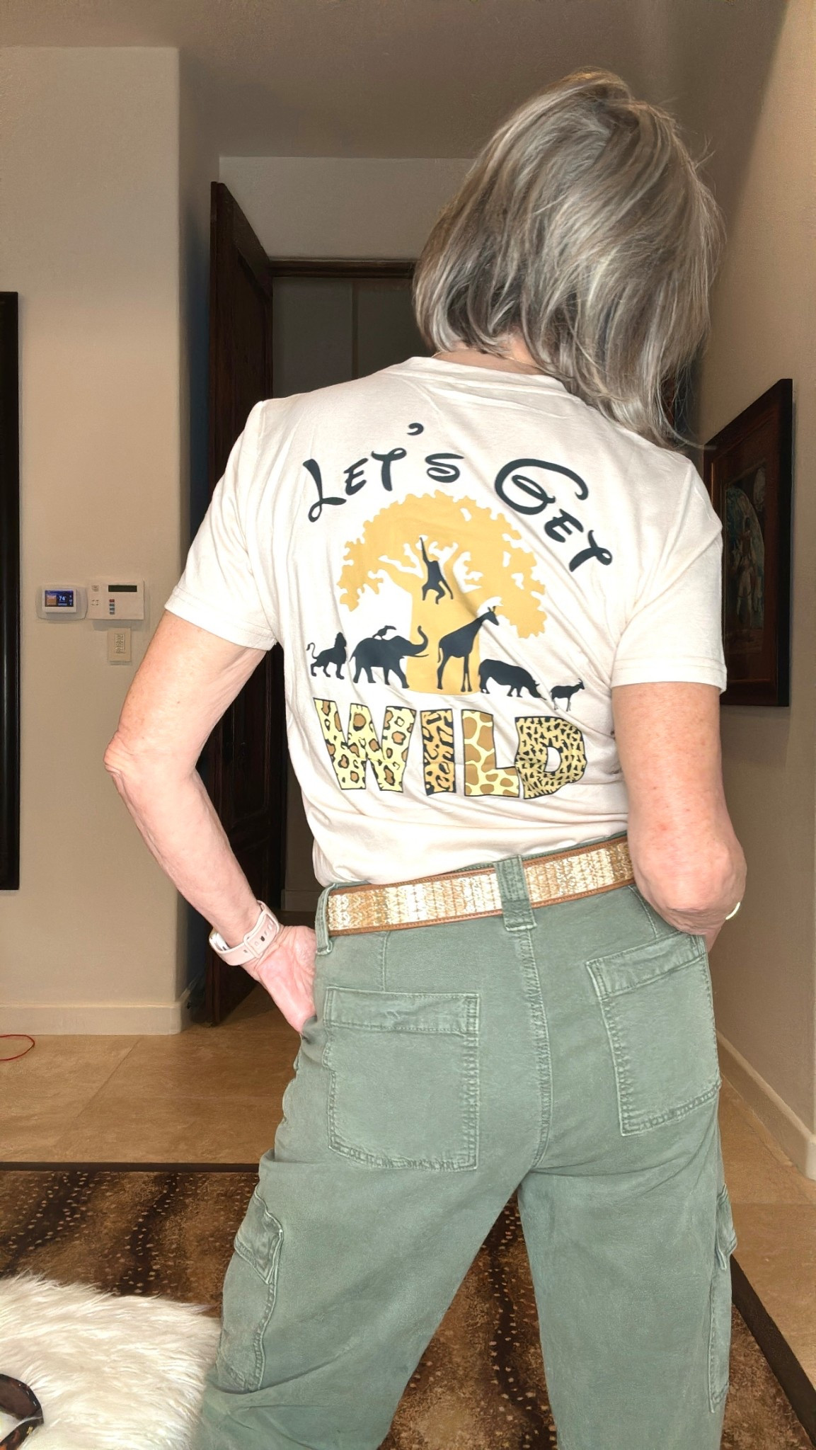 Graphic tee. Let’s Get Wild. 
Belt
Olive utility pants

#LTKTravel #LTKFindsUnder50 #LTKOver40