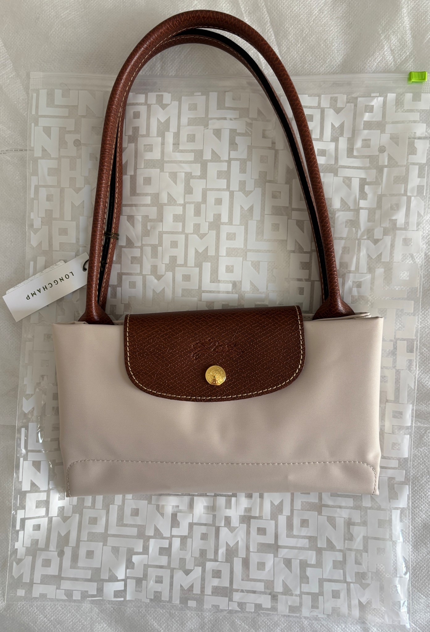 My new Longchamp Le Pliage in paper! Best color for summer!! 

#LTKStyleTip #LTKSummerEdit #LTKItBag