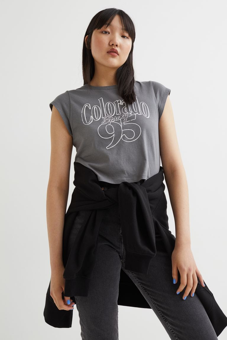 Crop top in soft cotton jersey with a printed motif. Ribbed neckline and short sleeves. | H&M (US + CA)