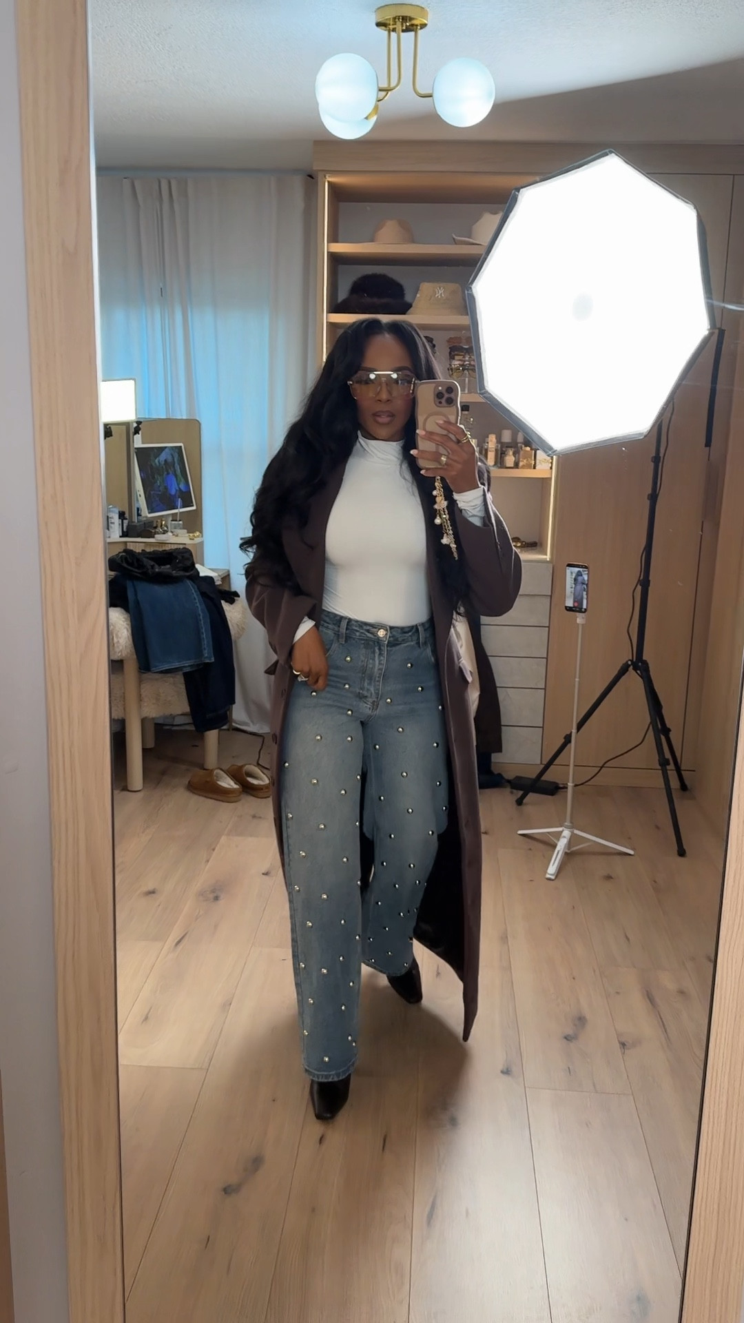 Sleek winter layers that make a quiet statement — the longline coat, elevated denim, and a clean fitted top come together so effortlessly. The pearl-detail jeans add the perfect touch of glam while keeping the look chic and wearable. 

Perfect for brunch dates, casual office days, and weekend city strolls.

📏 Sizing: Top (Small), Coat (Small), Jeans (27 Long)  
📐 Measurements: 5'4", 138 lbs, 34D bust, 27" waist, 40" hips

Timeless long coats, winter layering looks, elevated casual outfits, embellished denim trends, cold-weather wardrobe essentials, chic neutral styling, polished everyday outfits.

Follow me on Instagram and YouTube @kirasfashionfinds