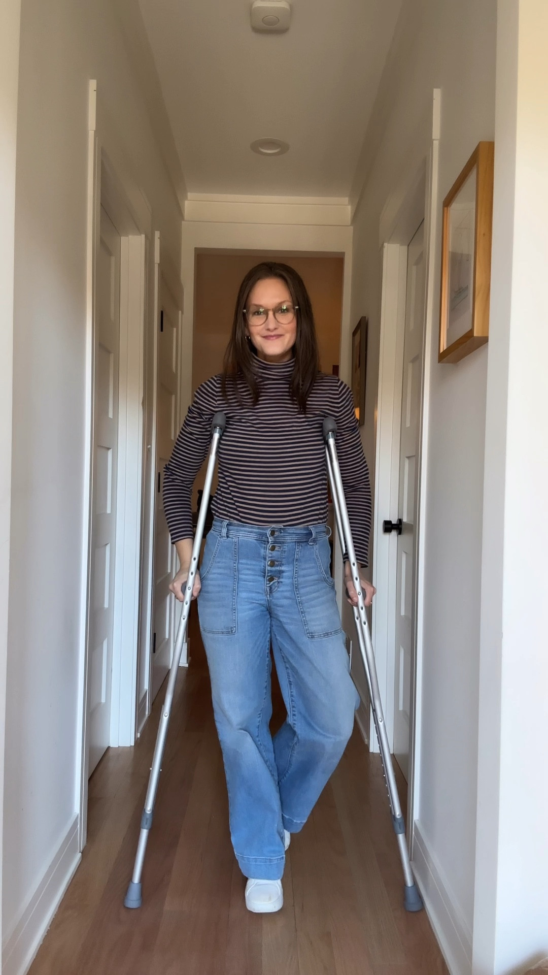 By Thursday, she had officially hit the just-get-through-it stage of ankle-brace life, sticking to the wide-legged jeans she'd been alternating all week and pairing them with a cozy navy-and-tan turtleneck that practically begged for no extra effort. Her gold hoops—always dependable, never judgmental—added just enough polish to keep her from feeling like she’d thrown in the towel completely. The outfit might have been basic, but her day was anything but: after a cheerful daycare drop-off, she found herself at her coworking space, buzzing with inspiration. Between brainstorming clever titles and outlining creative new blog posts, she remembered what it felt like to thrive—even if her wardrobe was in survival mode.

#LTKFamily #LTKWatchNow #LTKStyleTip