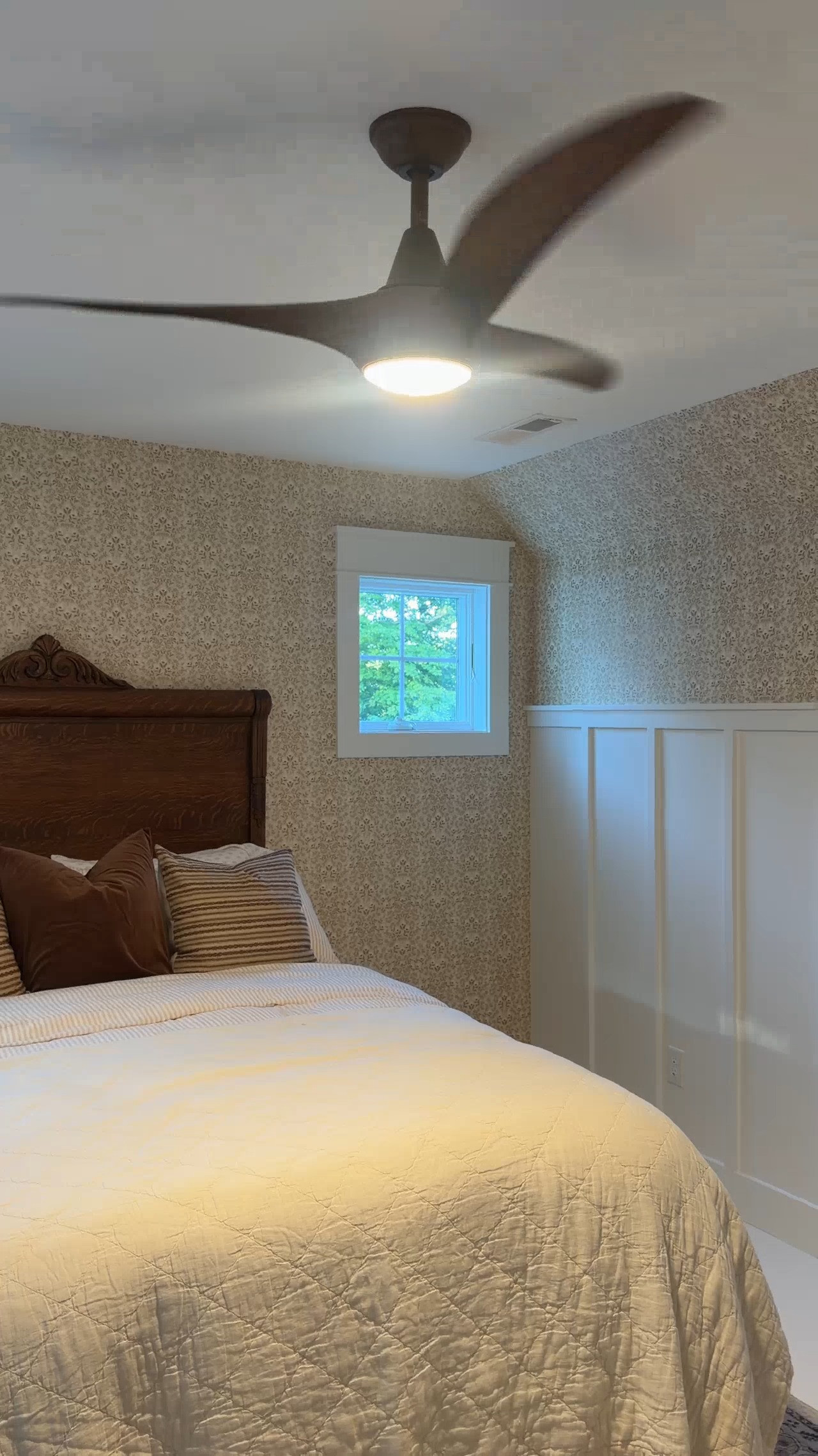 This is the ceiling fan that we added to our guest bedroom. It is metal with a wood finish, and I love the added light.  

 #LTKHome