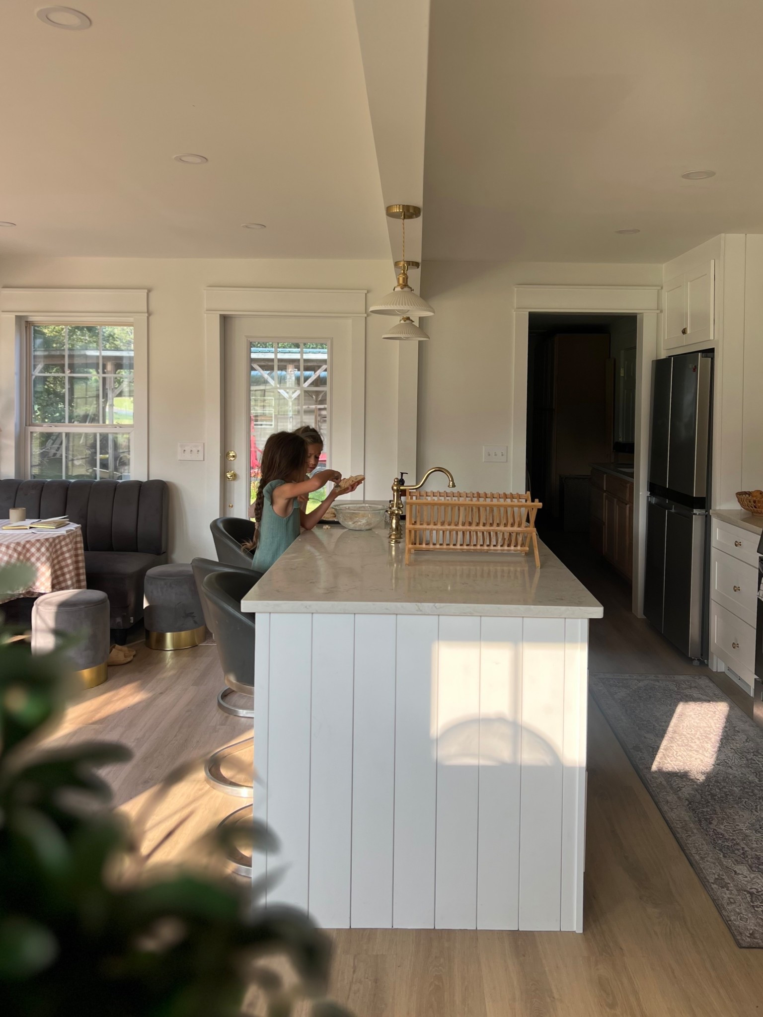 Modern farmhouse kitchen with white cabinets + gold hardware: 

Our kitchen island with quartz countertops has become the heart of our home—perfect for baking, cooking, and family gatherings. I love how the natural light plays on the shiplap island, wood floors, and open-concept layout.

Shop my kitchen finds:
- White quartz countertops
- Brass kitchen faucet
- Gold pendant lights
- Marble-look kitchen island
- Farmhouse dining chairs + round table

#kitcheninspo #modernfarmhouse #kitchendecor #whitekitchen #quartzcountertops #kitchenisland #goldhardware #homedesign #ltkhome #kitchenorganization



#LTKFamily #LTKHome