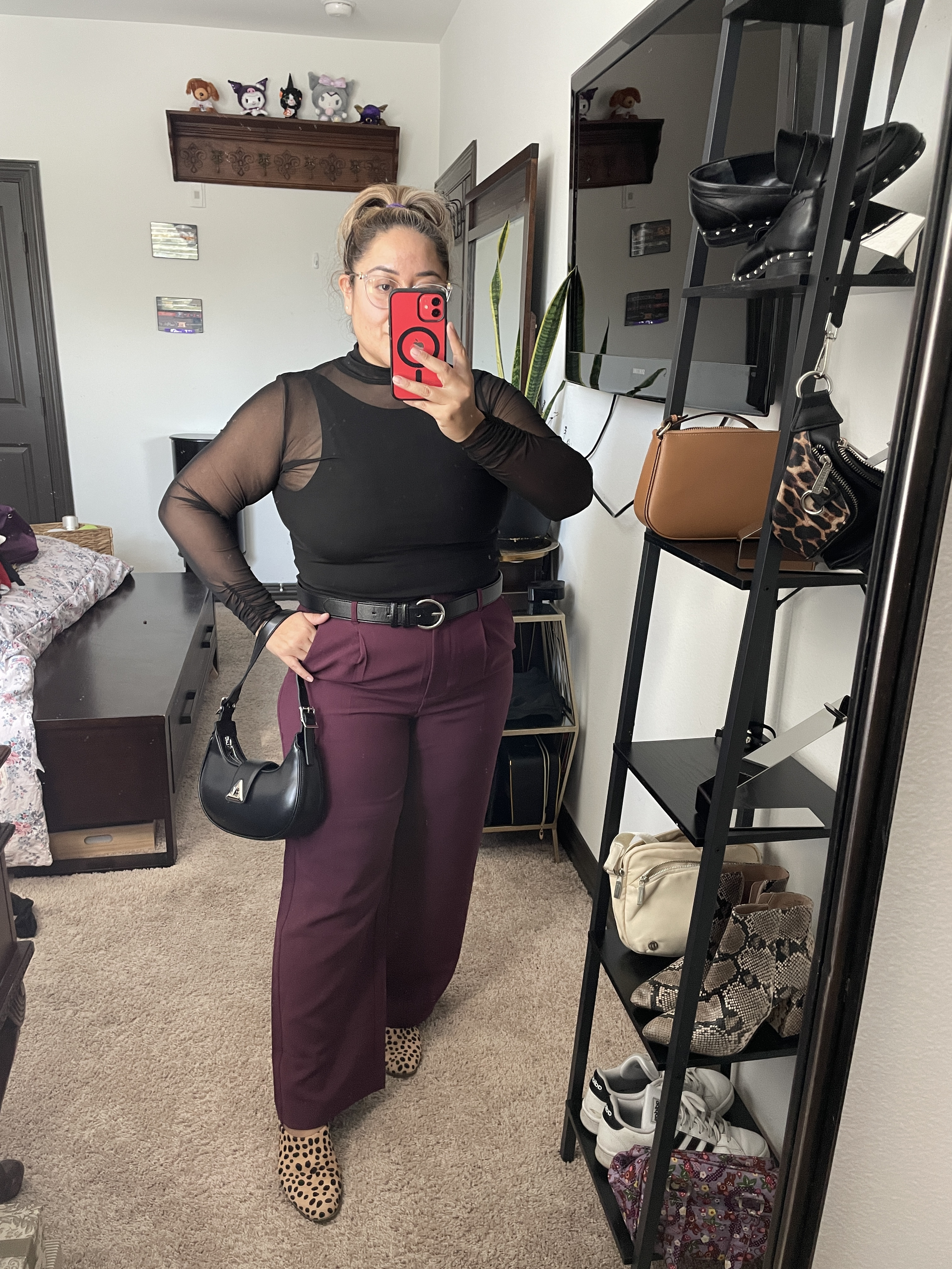 Edgy workwear. 
Amazon purse on sale in black color, comes in white as well. 
Mesh mock neck top from Free People. Wine trousers from Old Navy. I am wearing a size large petite. Animal print mules.

#LTKItBag #LTKWorkwear #LTKOver40