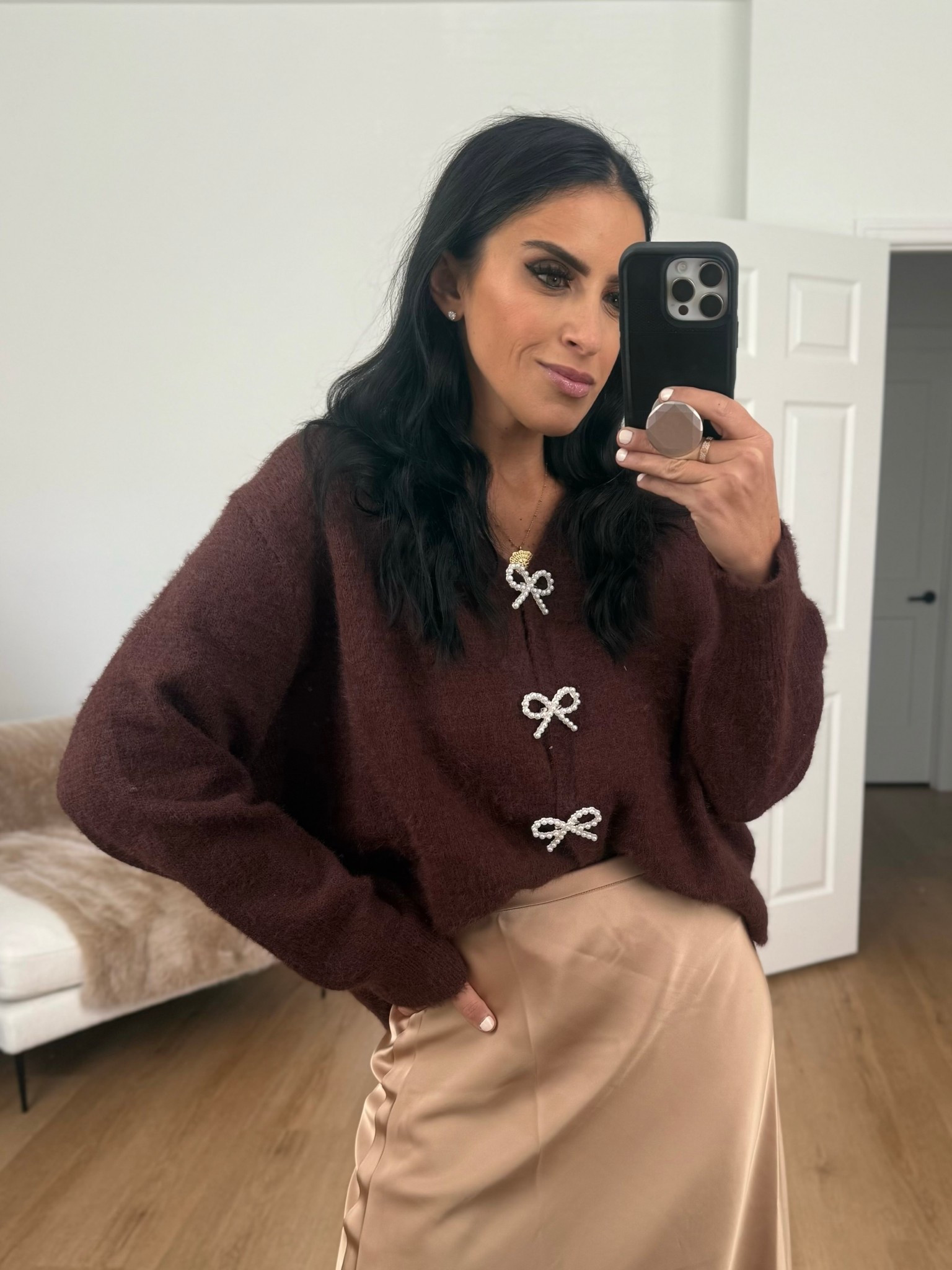 Satin Skirt Flowy A Line wearing size medium. Long Sleeve Knit Cardigan Bow Buttons wearing size small. 