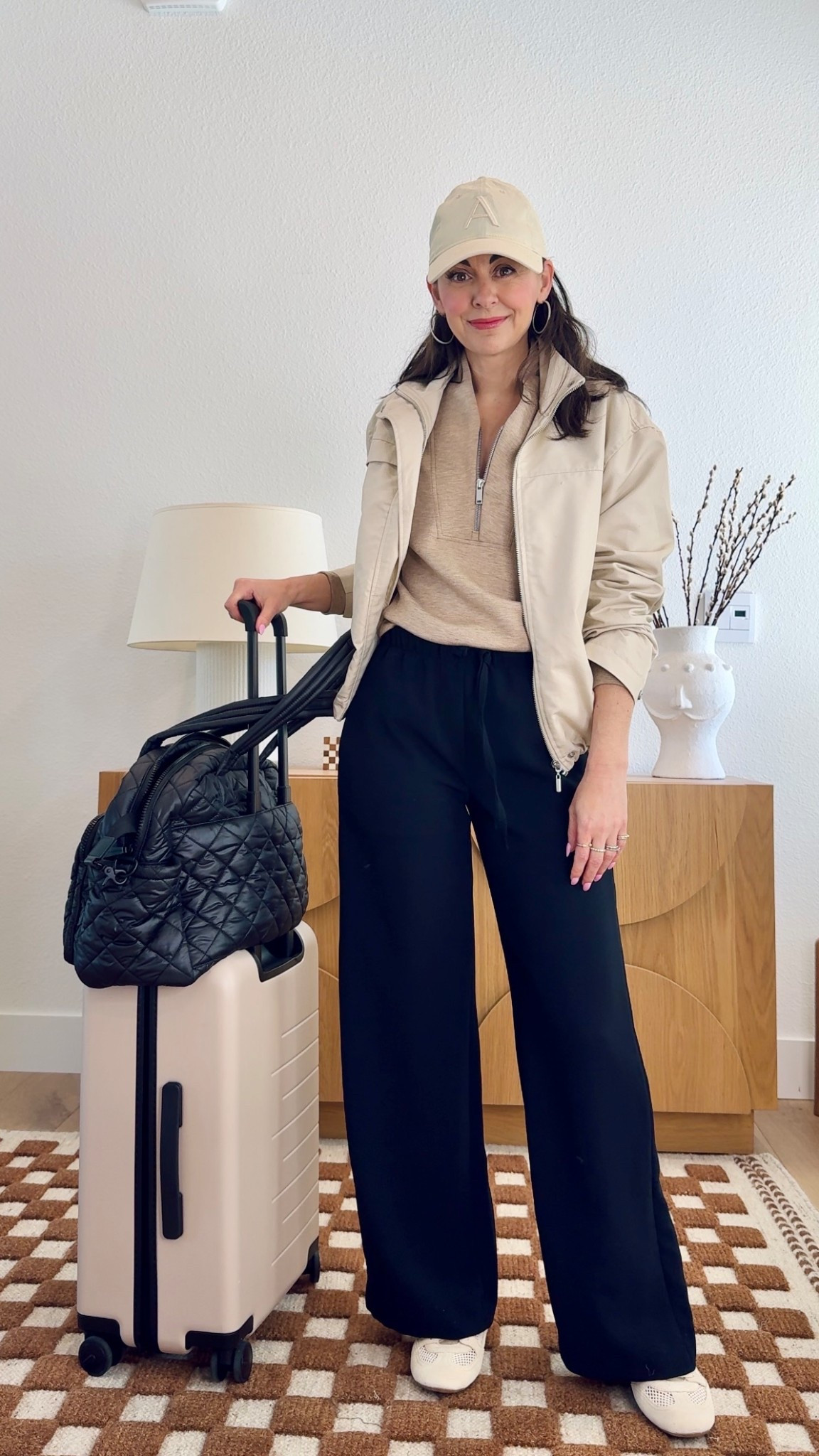 A comfortable and stylish travel outfit that’s not sweatpants plus my favorite luggage and tote with trolley strap