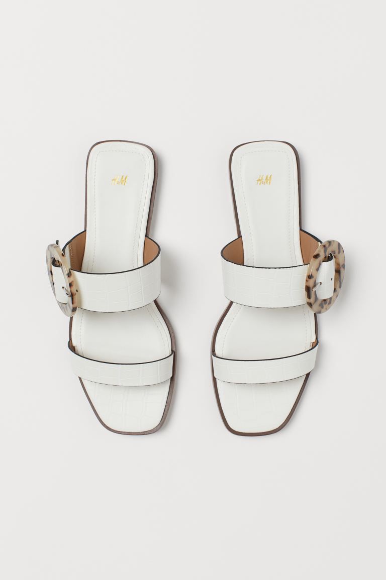 Slides in faux leather. Two straps, one with buckle. Faux leather lining and insoles. Heel height... | H&M (US)