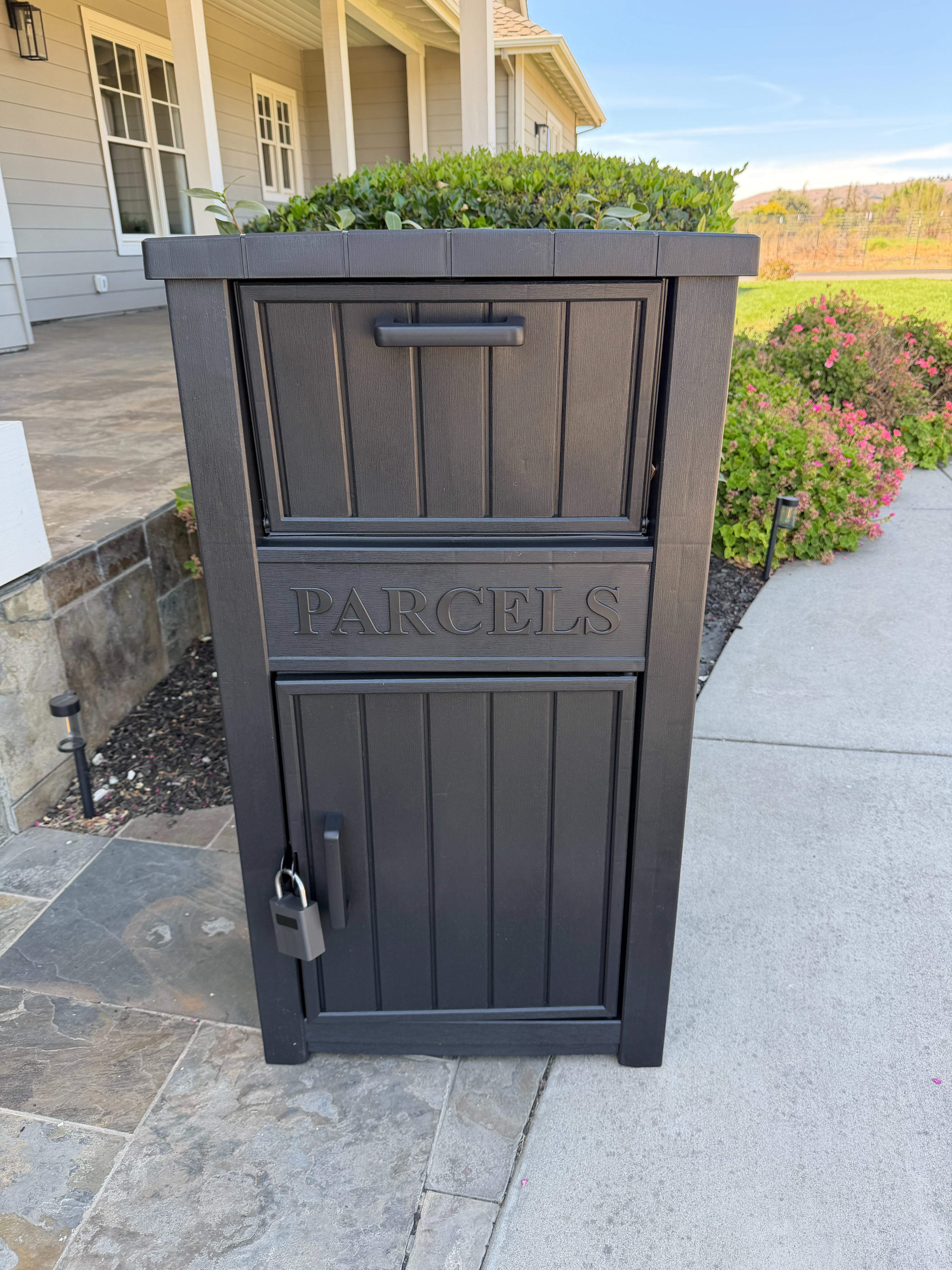 This secure outdoor delivery box keeps packages protected from rain, weather, and porch theft. With a lockable design and roomy storage, it’s an easy way to keep deliveries safe until you get home.
 

 #LTKHome