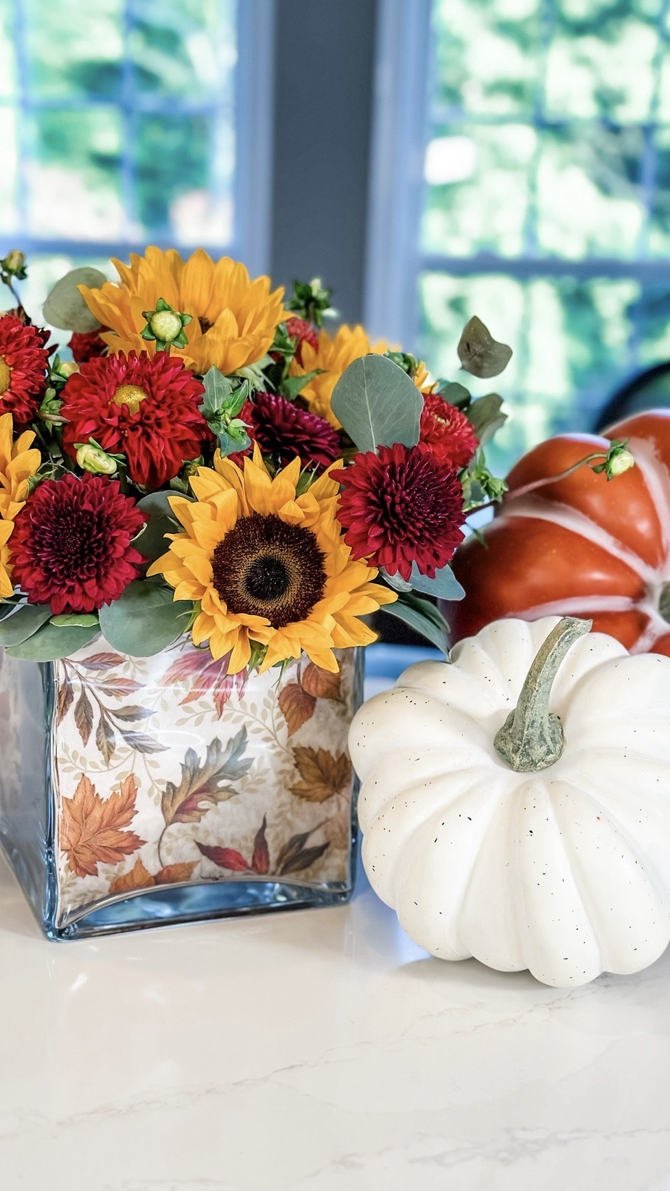 Fall Napkin Floral Arrangement 💛🍂 Such an easy way to make grocery store flowers look extra special!

I simply lined a clear vase with a pretty fall napkin, then used a smaller vase inside with a tape grid to keep the sunflowers, mums, dahlias & eucalyptus right where I wanted them.

Easy, affordable and completely customizable for any season or holiday. Perfect for your fall table or as a sweet hostess gift! ✨

#LTKHome #LTKSeasonal #LTKWedding
