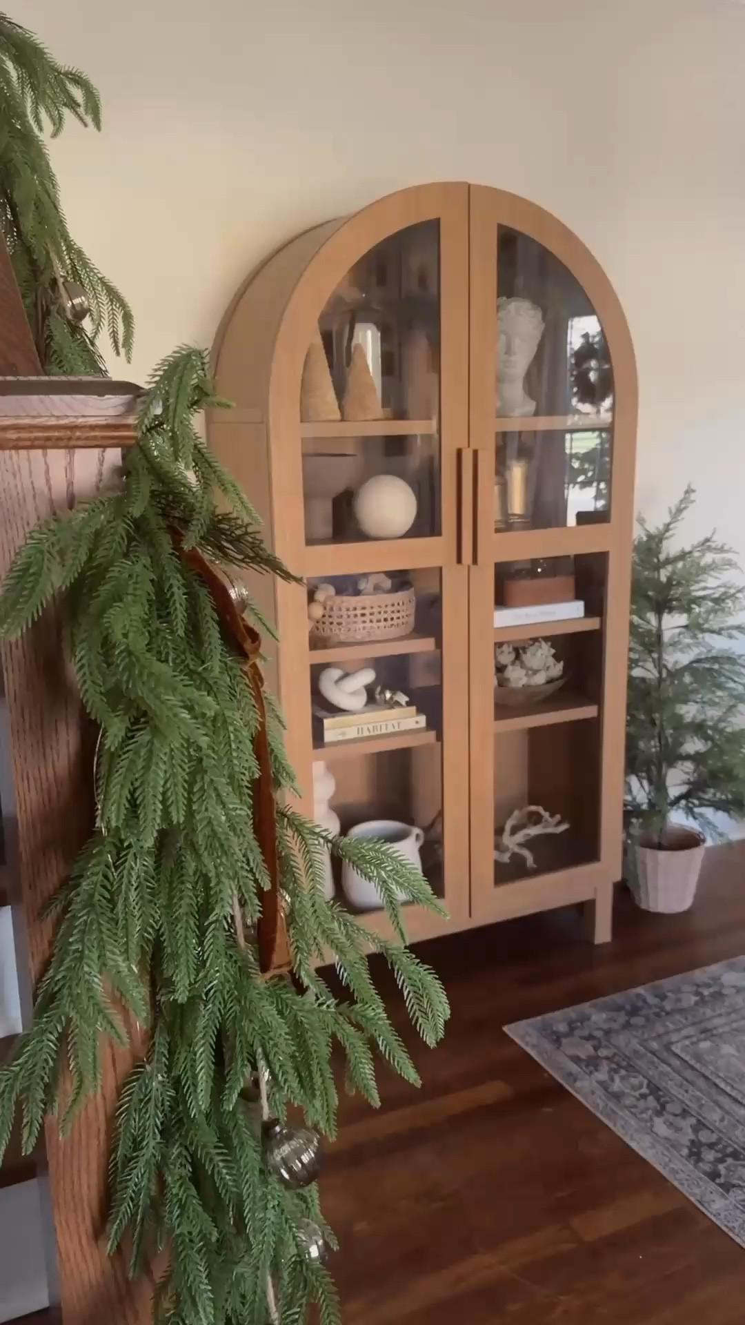Arch cabinet (currently on sale!) styling with neutral Christmas decor. A lot of what I used to decorate the shelves is older & sold out 😕 Linking to what is still available! 🤎

#LTKWatchNow #LTKSaleAlert #LTKHome