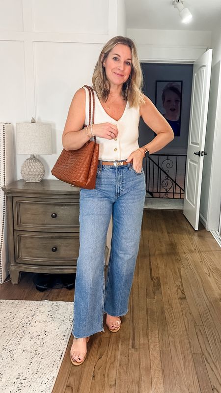 Dress this casual outfit up with some neutral, simple heels and a statement bag! Small top, tts jeans in short  

#LTKSpringSale #LTKstyletip #LTKfindsunder100