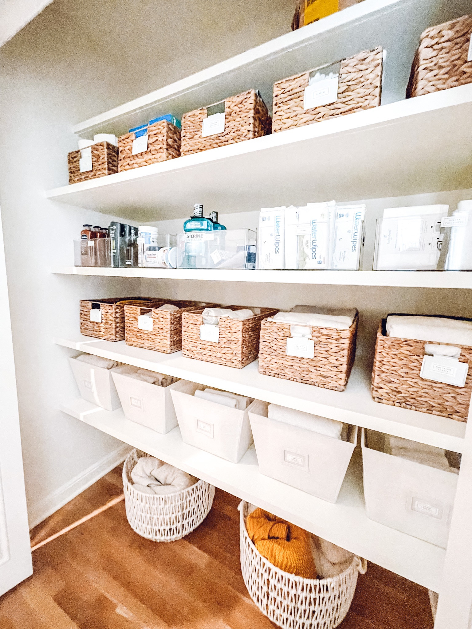 Linen closet organization. The Container Store Water Hyacinth Storage Bin, bin clip, and Luna basket. Amazon Water wipes✨

#LTKkids #LTKfamily #LTKhome