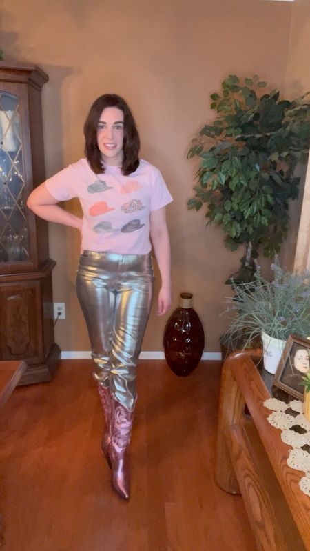 Country Concert Outfit - Pink cowboy hat tshirt (size small). High waisted silver straight leg pants (size 27/4). Pink metallic cowboy boots (size 8.5). #countryconcertoutfit #countryconcert #pinktshirt #tshirt #silverpants #highwaistedpants #boots #cowboyboots #pinkboots 

#LTKStyleTip #LTKSeasonal #LTKFindsUnder100