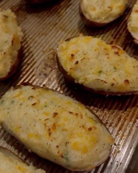 Twice baked potatoes 
(makes 8 overfilled halves)

Ingredients:

•6 russet potatoes (washed and dried with skin left on) 
•1/2 cup milk (add more if desired for consistency)
•4 tbsp butter 
•1.5 cups of shredded Colby Jack cheese 
•1-2 tbsp diced green onion/chive 
•Generous amount of Garlic salt and pepper to taste (i always do a taste test before i start filling incase it needs more salt or pepper) 

Recipe: 

*Short on time way*- poke your potatoes with a fork a few times and microwave for 5 or so minutes on each side until tender. 

*Non time crunch way* - coat lightly in oil and a little salt and bake for 1 hour at 450 degrees or until tender.

Let cool for a few minutes before you cut long ways. Place your butter in a bowl before you start scooping out your potato that way the butter softens and melts as you’re filling your bowl. I use an ice cream scooper to scoop out my filling, make sure to leave about 1/2”- 1 inch of potato along the edges of your shell so it doesn’t break/crumble. Add in your milk, cheese, seasoning and onion and mix well. Use a spatula to scoop your filling back into the potato. I like mine overfilled so i use 6 full potatoes but only fill 8 halves that way they’re nice and full. Bake at 400 for another 15 min or until the tops start to get golden brown and add whatever other toppings you want and enjoy! 
(Toppings ideas: crumbled bacon, sour cream, shredded bbq meat)