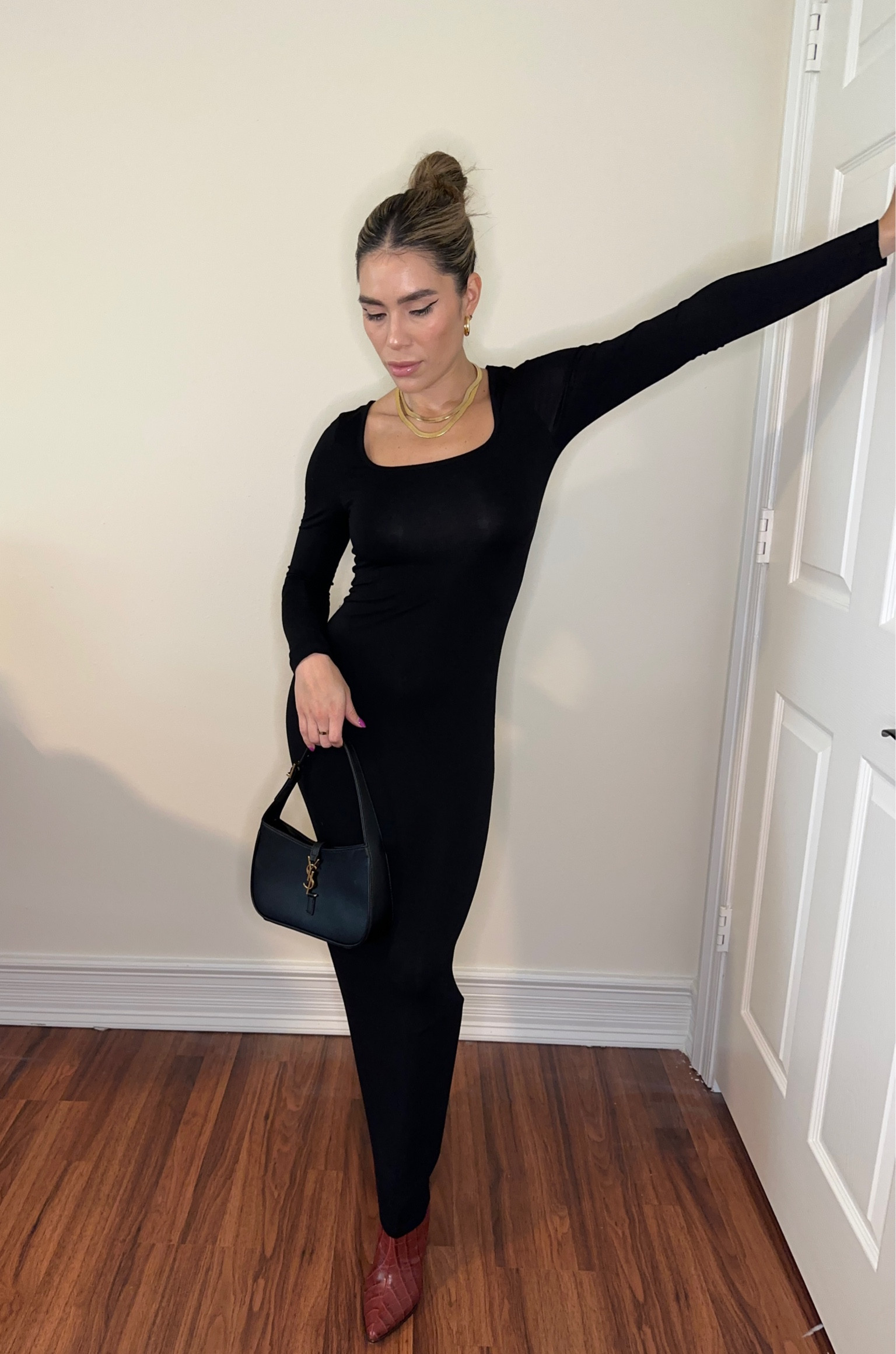 Black dress with red boots 

#LTKshoecrush #LTKstyletip #LTKSeasonal