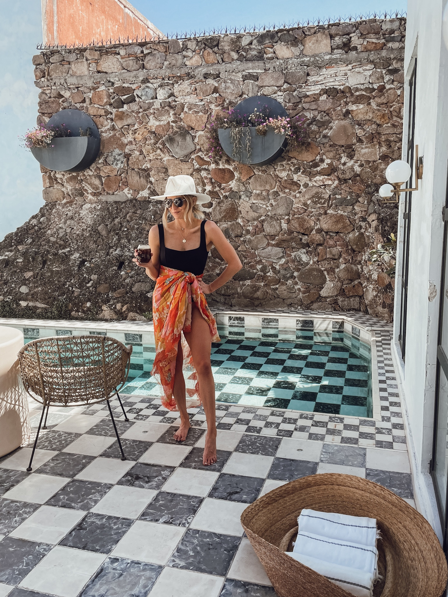 Flattering black swimsuit, similar sarong, similar hat and gold necklaces. 

#LTKswim #LTKFind #LTKtravel