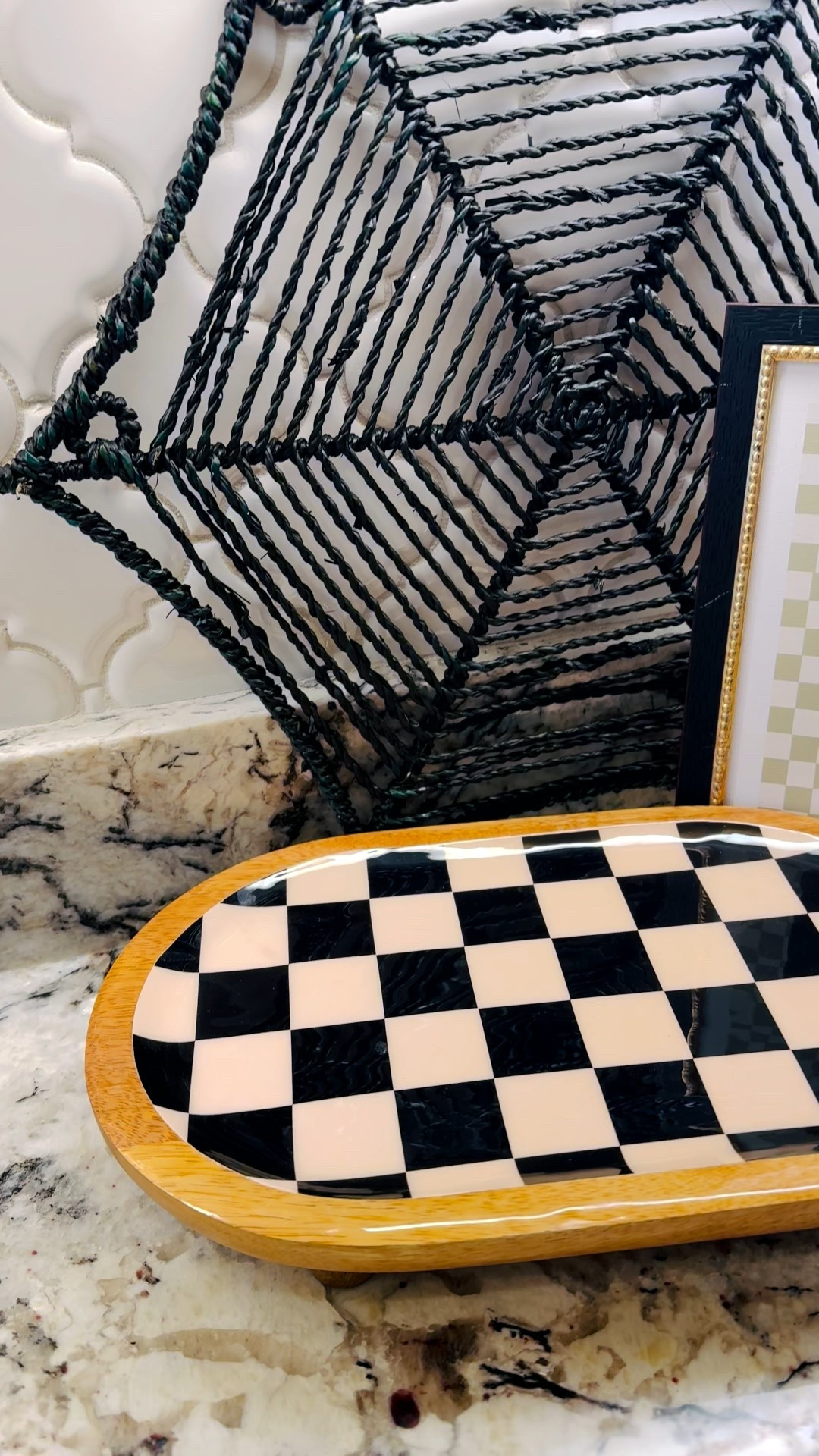 I love adding one or two seasonal pieces to my everyday kitchen — something that feels festive but still grown-up. For this vignette I layered a black rope spiderweb against the backsplash, then placed a small wooden checkerboard tray in front and a framed ghost print for height and personality. The mix of wood, black accents, and a neutral ghost keeps the look cozy, not kitschy.

Styling tips:
• Use odd numbers — three pieces gives balanced visual weight.
• Add height at the back (framed art or greenery) and a low functional piece (tray or bowl) in front.
• Keep the color palette to 2–3 tones so the look feels curated.

Perfect for renters or busy homes — everything folds away for parties or everyday use. Link to everything I used below — tap to shop! 🛒

#HomeDecor #HalloweenDecor #KitchenStyling #CountertopDecor #Checkerboard #SeasonalStyle #LTKHome #LTKSeasonal

#LTKHome #LTKSeasonal #LTKFamily