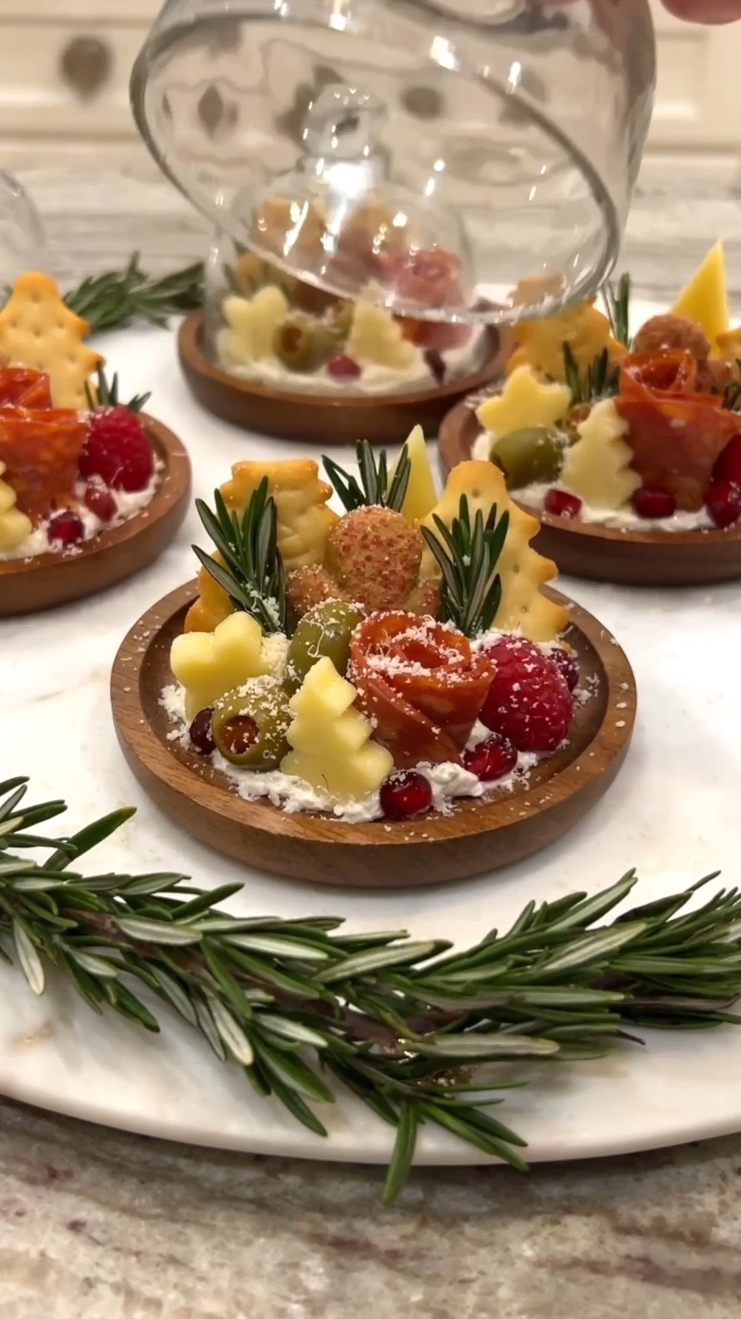 Mini cake stands get topped with charcuterie favorites and seasonal accompaniments. Set out at your winter festivities for a cute and creative appetizer to serve your guests! 

#LTKHoliday #LTKSeasonal #LTKfoodie