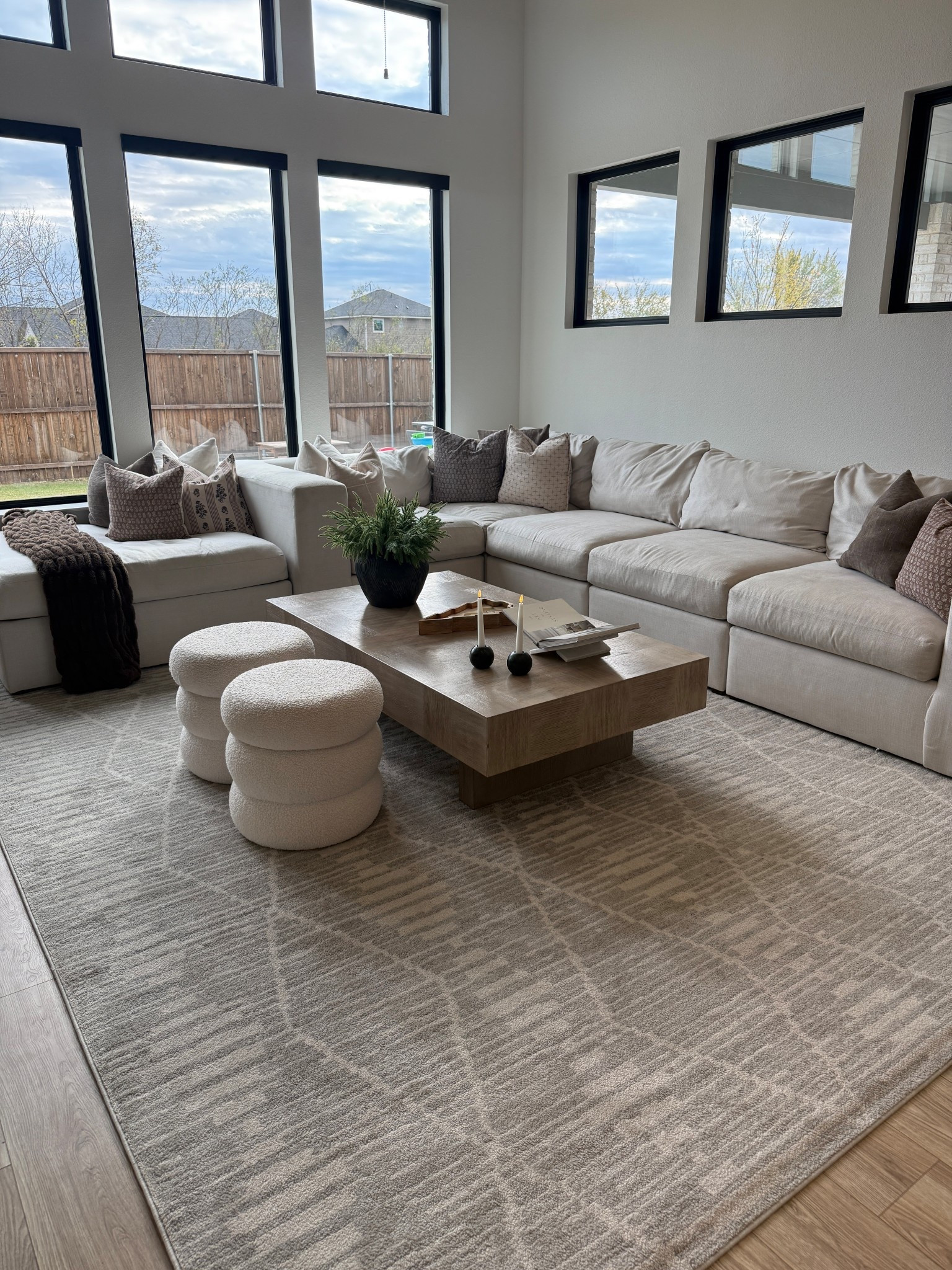 Wayfair coffee table and rug, Walmart ottomans 

#LTKHome