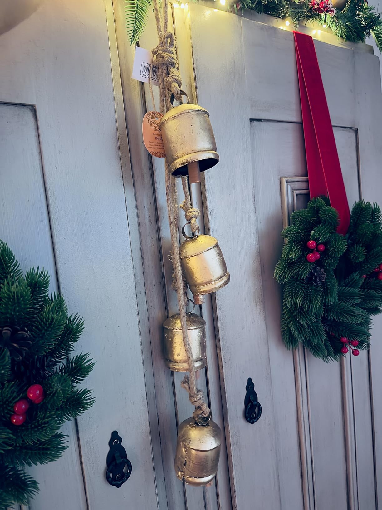 Deco 79 Metal Handmade Tibetan Inspired Decorative Cow Bells with 4 Bells on Jute Hanging Rope, 4... | Amazon (US)