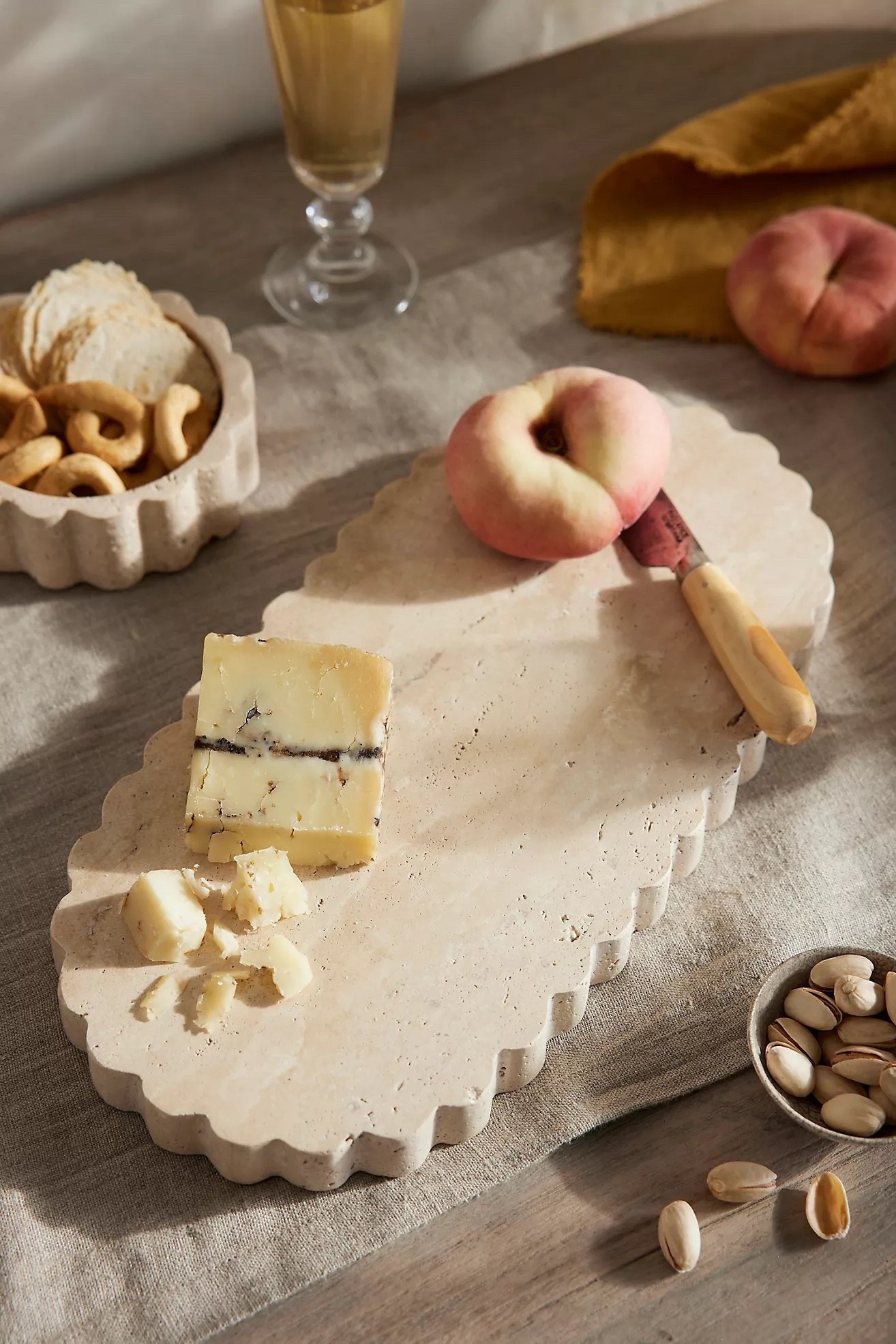 This scalloped travertine serving board from Anthropologie will instantly elevate whatever you out on it 😍🧀🍫🍷 it’s perfect for hosting all your holiday festivities or to give as a gift to the hostess in your life. 

Hostess gifts, serving boards, Anthropologie home finds, hosting essentials, neutral home, holiday parties, serving board ideas, serving board gift ideas, travertine tray 

#LTKHome #LTKParties #LTKFindsUnder100