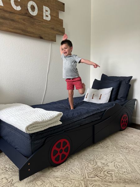 The cutest race car bed for little boys! I wanted a wooden one and a more subtle color, so this one was perfect for us! 

Available on Overstock. Also comes in a few other colors. This works with a full size mattress (shown here) or with a 6 inch, low profile mattress.

#LTKfamily #LTKkids #LTKhome