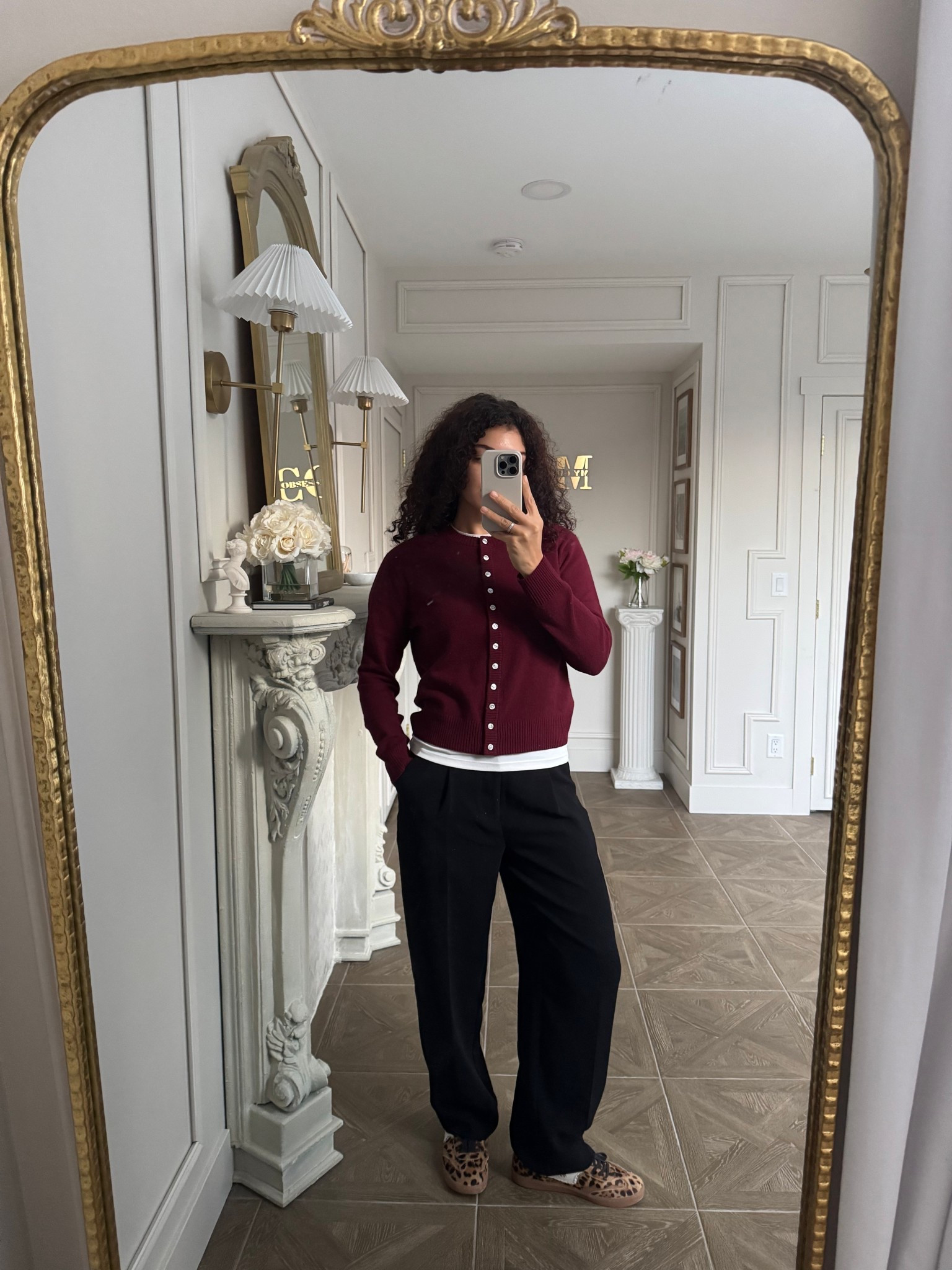 burgundy cardigan, white tee, black pants, leopard print sneakers 

#LTKootd