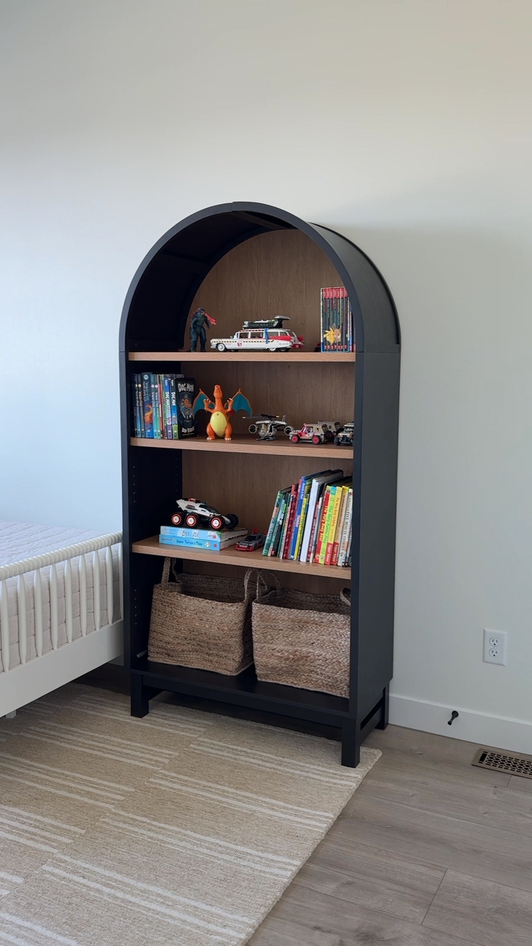 Can you believe this arch bookshelf is from Walmart?! I love the contrasting wood interior + shelves. 

#LTKHome