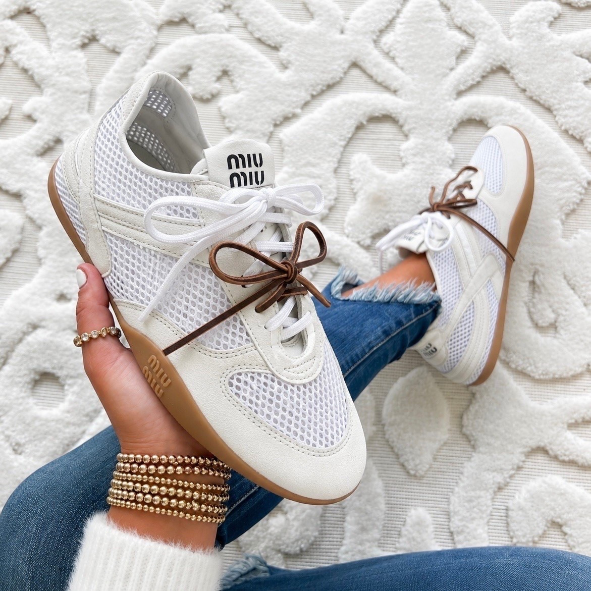These Miu Miu Gymnasium Mixed Media Low Top Sneakers are the perfect blend of sporty and luxe. The signature double lace detail that makes them instantly recognizable. They fit true to size with a comfortable, supportive feel that’s perfect for all day wear.