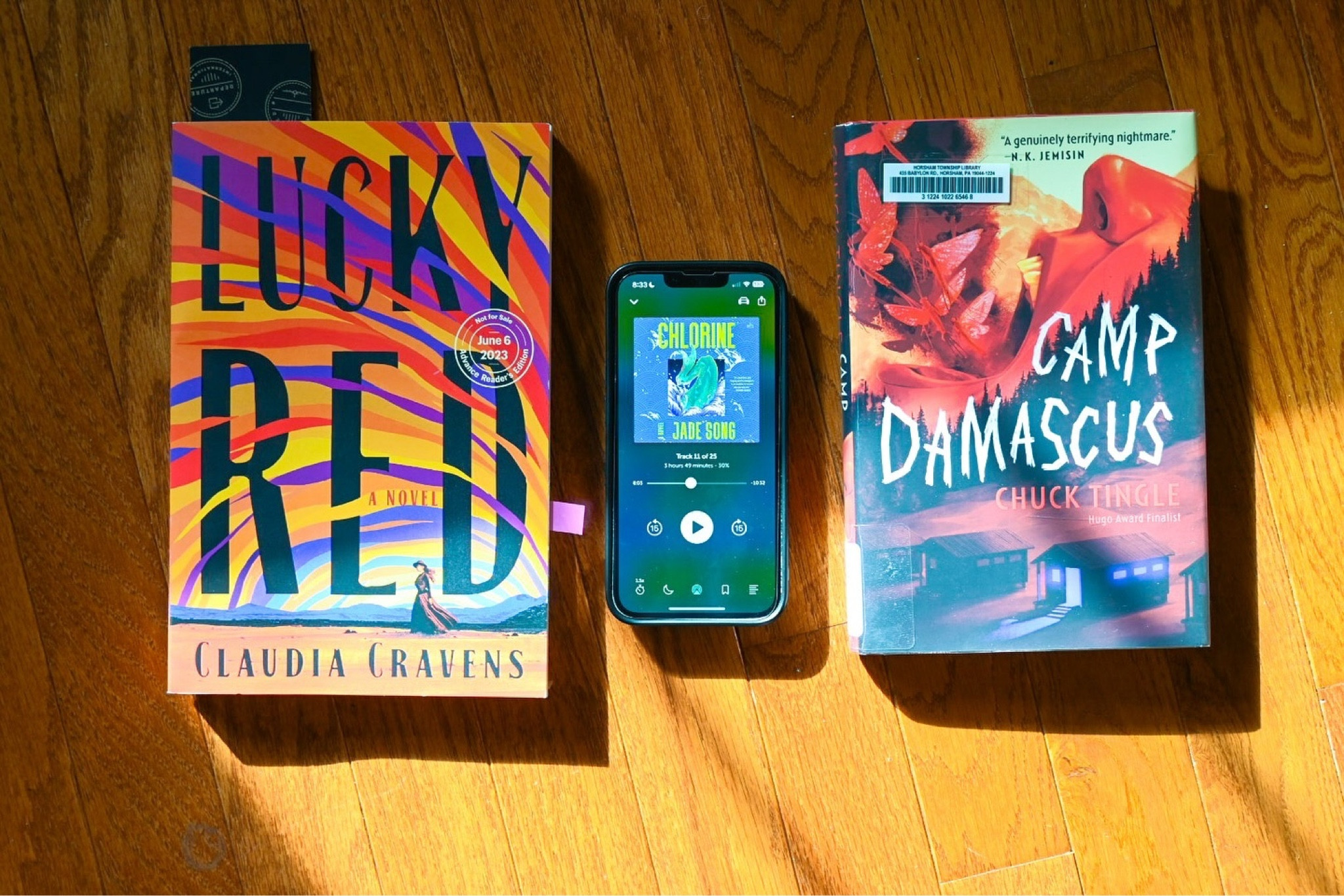 LAST, NOW, NEXT 

It’s the last week of June & #TheAmazingReadathon, so here’s a reading update! 

Last: Lucky Red by Claudia Cravens, narrated by Elena Rey — A queer Western with sapphic love, a brothel with queer women, and survival. This was *everything*!! The audiobook made the book more immersive. I will say, it’s definitely a book I need to reread because there’s definitely things I missed 😅 

Now: Chlorine by Jade Song, narrated by Catherine Ho and Imani Parks — I’m about 40% in and loving it. It is a heavy read. This is a literary horror following Ren, a competitive swimmer who is also a mermaid. It shows the horrors of what young athletes go through with pressure & ab*se from their coach + the inappropriate relations. On the flip side, there’s the POV from Cathy, a girl who is  infatuated with Ren, but doesn’t know Ren has the same feelings. Audiobook is great! 

Next: Camp Damascus by Chuck Tingle 
— I actually did start this but haven’t had the proper time to devote to it. Hoping to use it to check off the “Creepy Queers” space for #QueerLitRead 🏳️‍🌈

Q: What are your Last, Now, Next reads? 📖

[ID: An image of three books lying on a wooden floor. See caption for book titles. End ID.]

#QueerBooks  #QueerLit #QueerBooksta #TransBookstagrammer