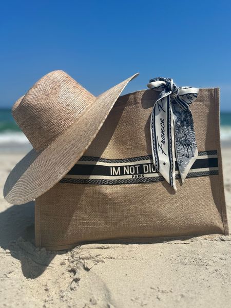 Beach day/summer must haves: a wide brim straw hat and a cute beach bag. I love this designer look for less bag. 

#LTKstyletip #LTKSeasonal