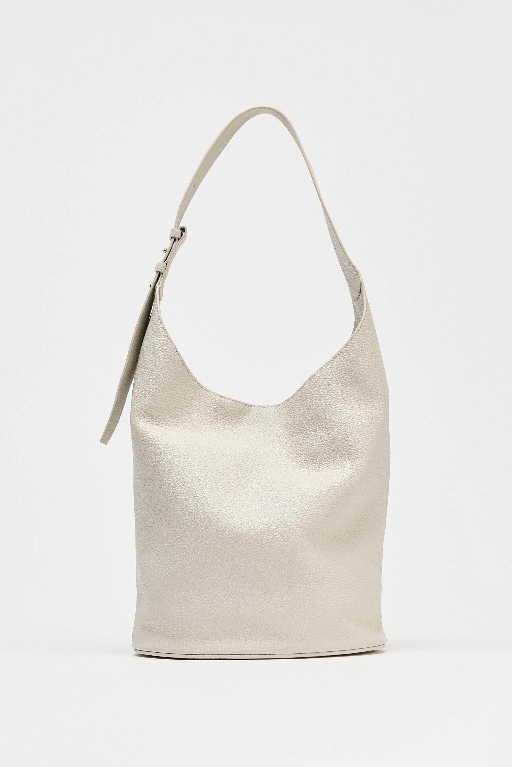 Leather bucket bag. Textured finish. Adjustable shoulder strap to wear as a crossbody bag. Inside... | Zara UK