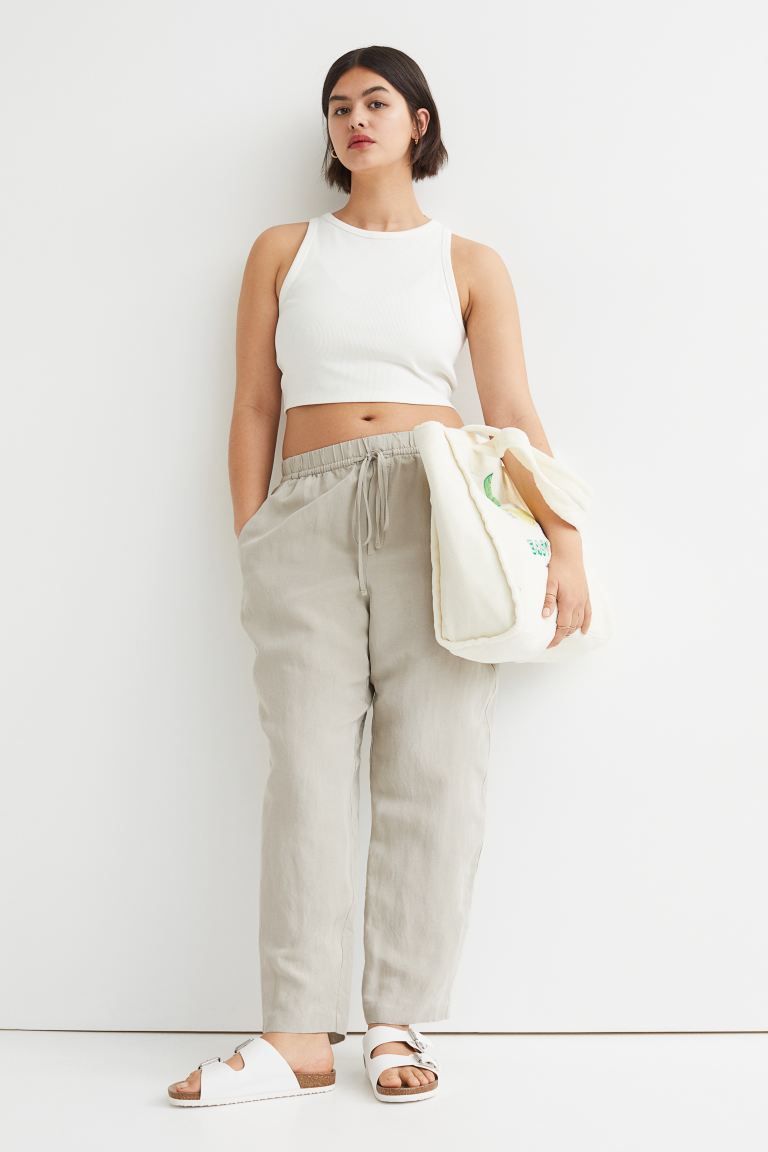 Ankle-length pants in a woven linen and viscose blend. High waist, drawstring and covered elastic... | H&M (US + CA)