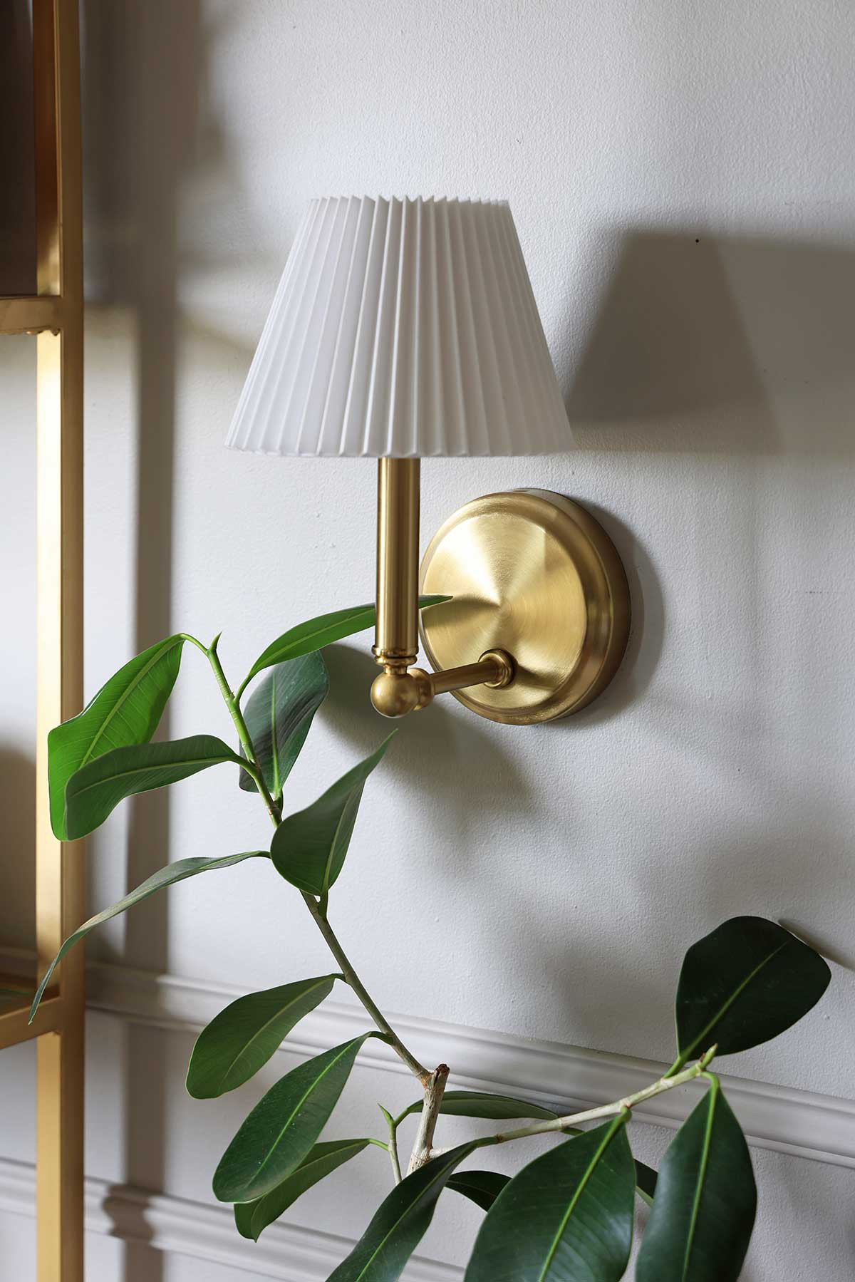 Incredibly charming brass sconce with pleated shade | The perfect little light fixture to fill an empty corner and add a little ambiance! #wayfair @wayfair 

 #LTKHome