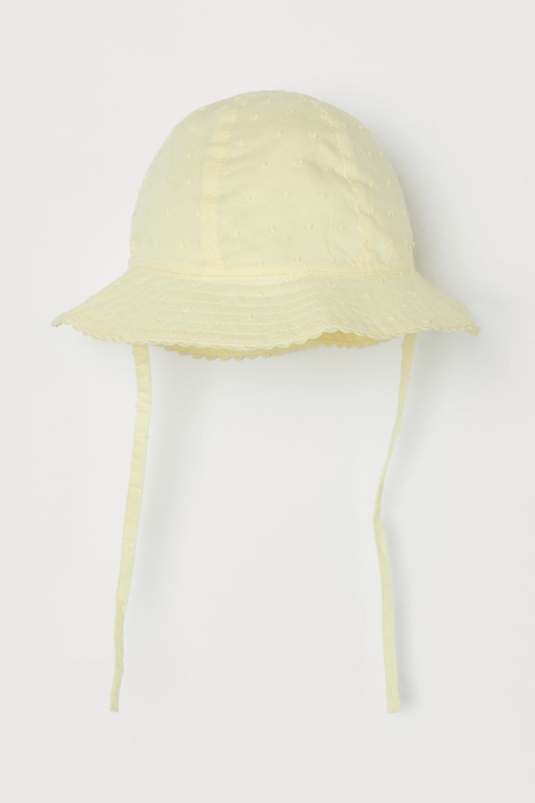 Sun hat in airy, woven cotton fabric. Wavy brim and ties underneath. Lined. | H&M (US)