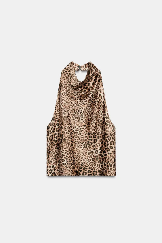 Model height: 180 cmHalter neck top with an open back. Back fastening with hidden buttons. | Zara IT