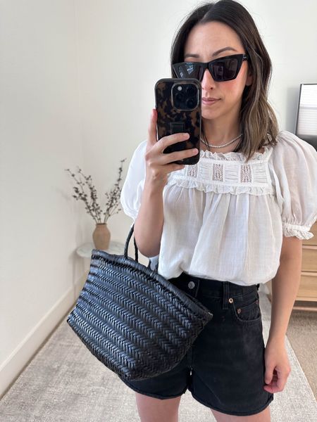 Doen Frances top. Back in-stock. I’m wearing the xs. 

Doen Frances top xs
AGOLDE Dee shorts 26. I sized up 2 ski es. 
Dragon Diffusion tote 
Hermes sandals 35
YSL sunglasses 

Jean shorts, petite style, white top, summer style. 

#LTKitbag #LTKstyletip #LTKshoecrush