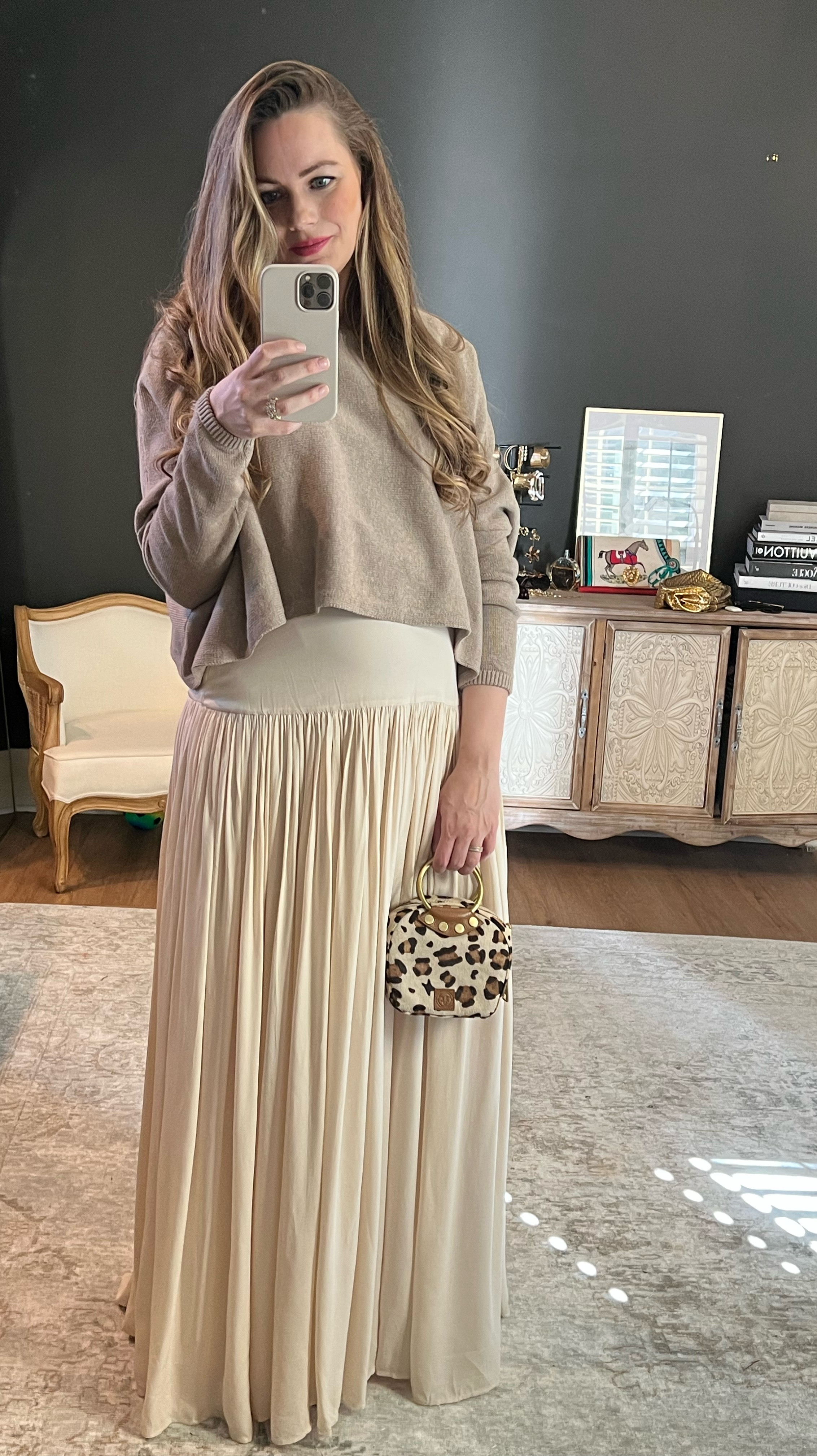 Maxi cream skirt with my House of Nizhoni cropped oversized sweater — perfect bump-friendly outfit for this transitional season! Pop of leopard in the cutest bag // tagged on similar! 

#LTKWorkwear #LTKBump #LTKStyleTip