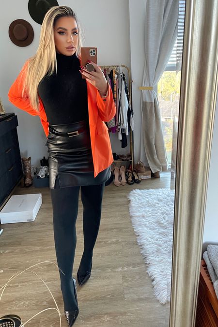 Work, but make it spooky 🎃 wearing a turtleneck from Target, faux leather skirt from Old Navy, and an orange blazer from Shein! 

#LTKSeasonal #LTKstyletip #LTKworkwear